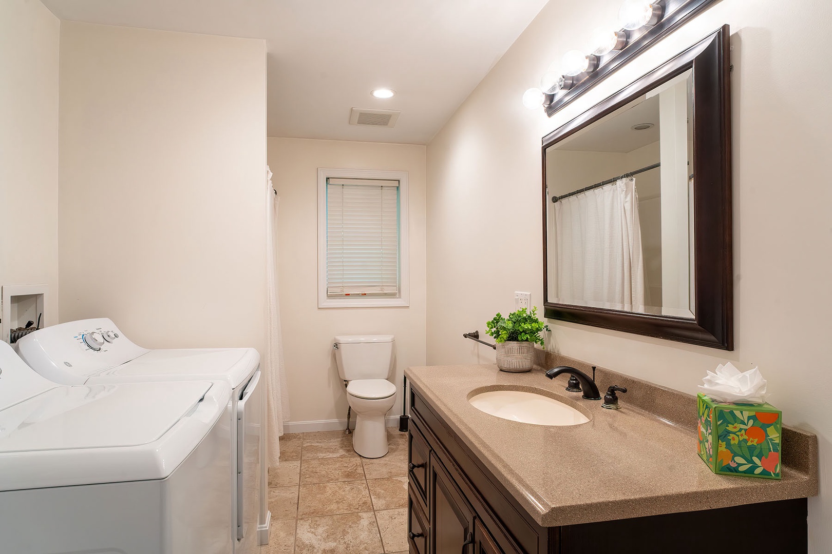 Apartment full bathroom with laundry