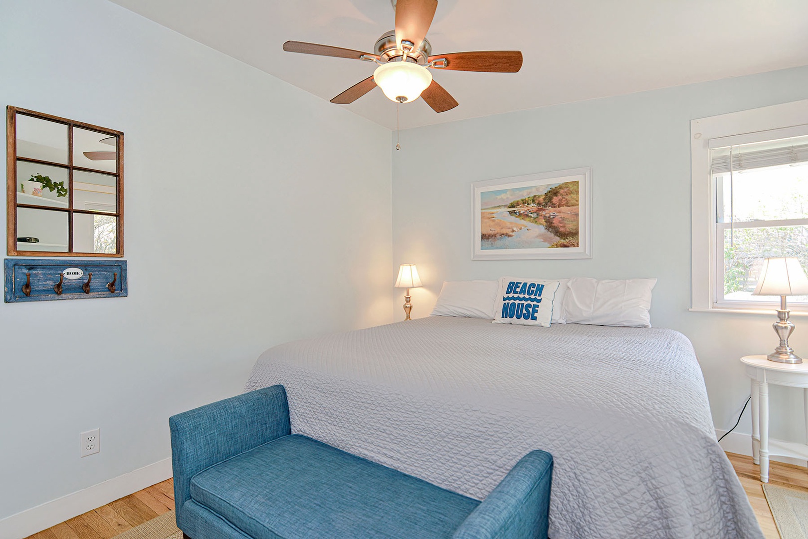 The primary bedroom includes a ceiling fan.