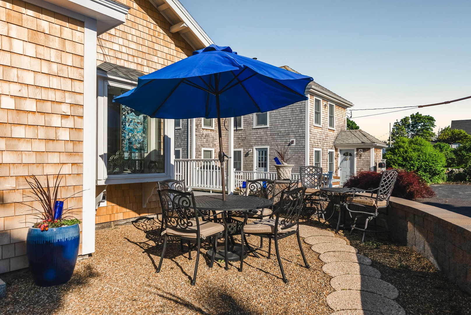 Front of the house with outdoor seating.