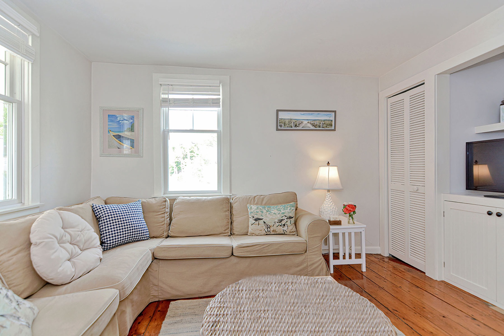 The Living Room has a comfy sectional sofa and flatscreen TV.