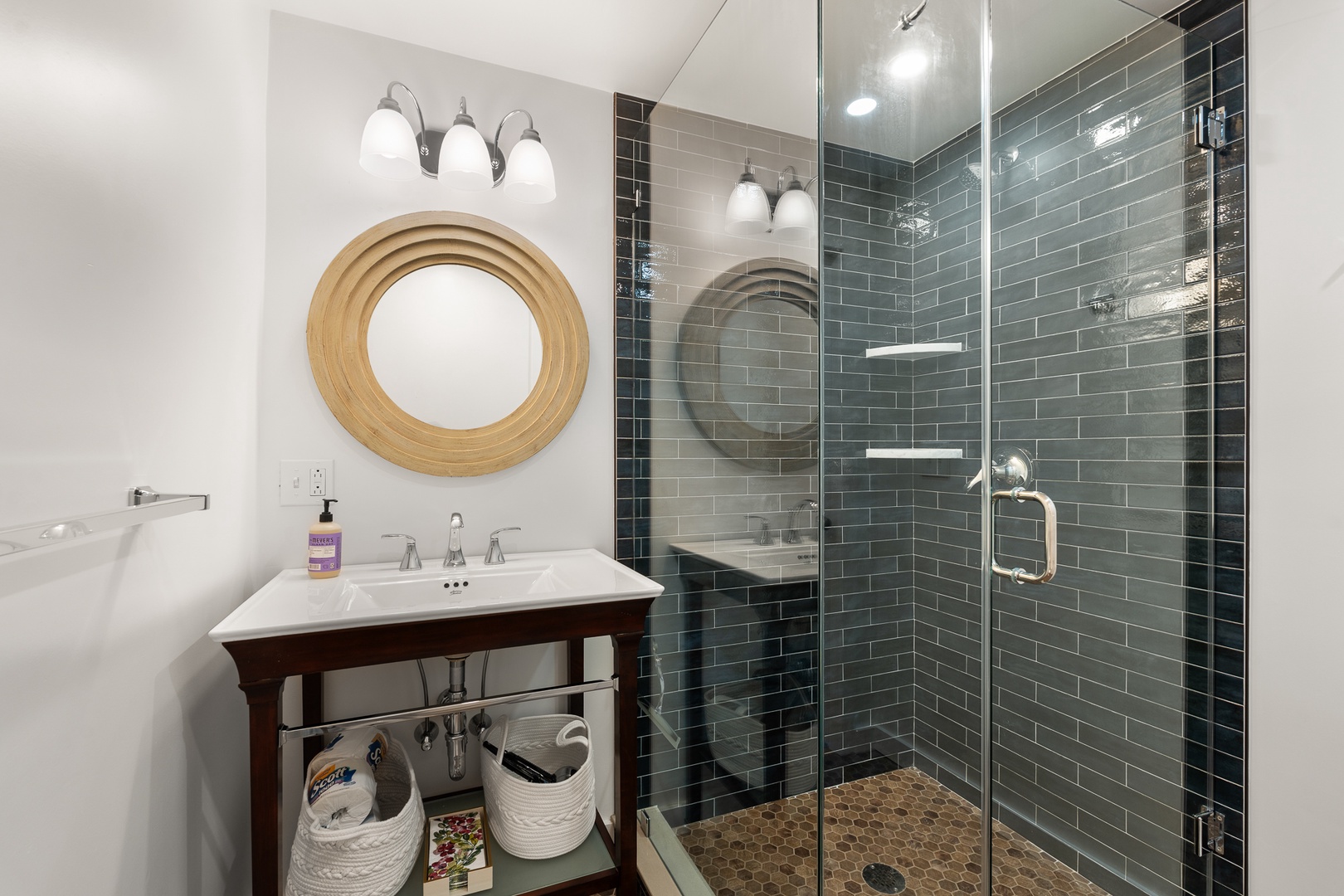 This en-suite bathroom includes a walk-in shower.