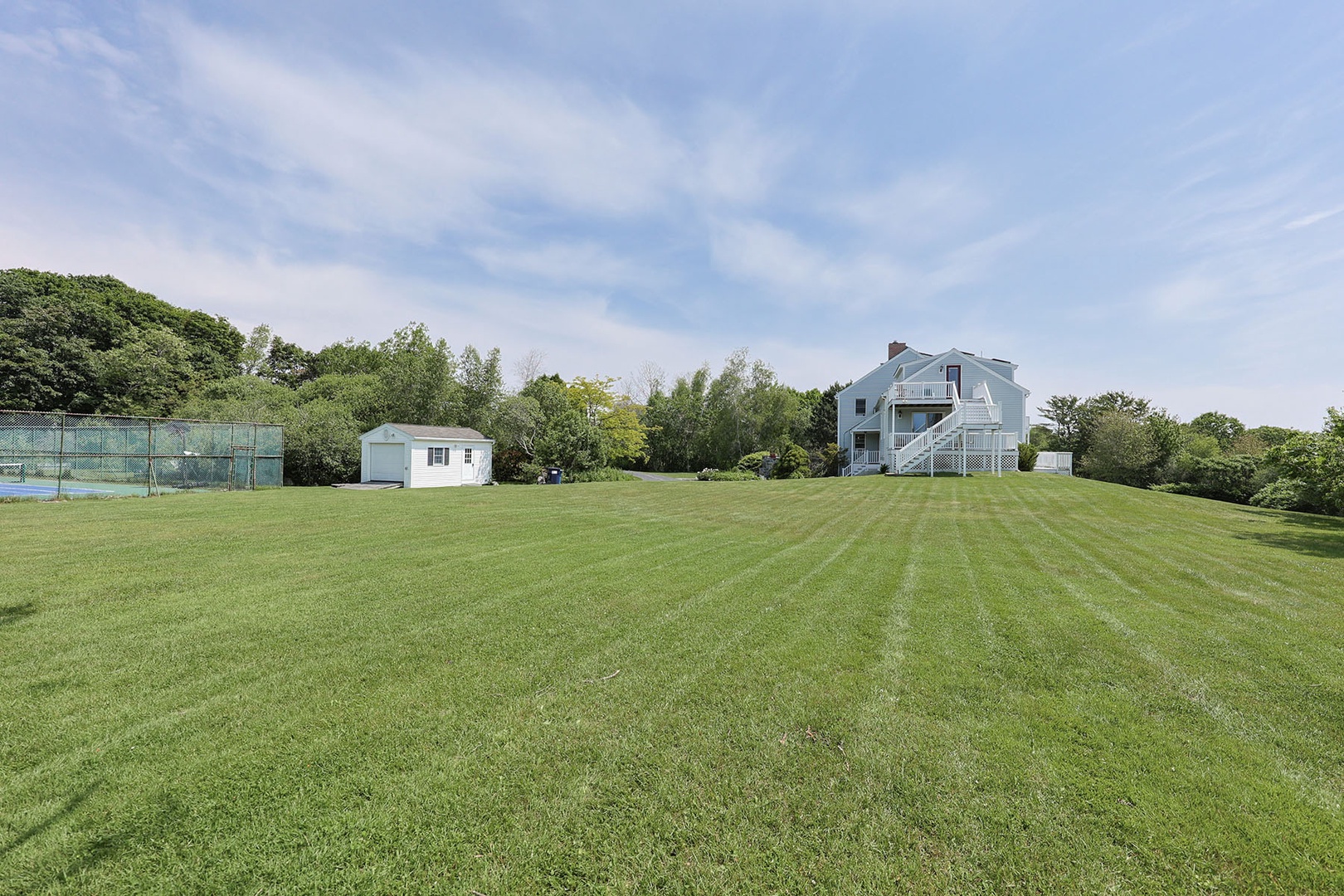 The spacious yard is perfect for outdoor games and gatherings.