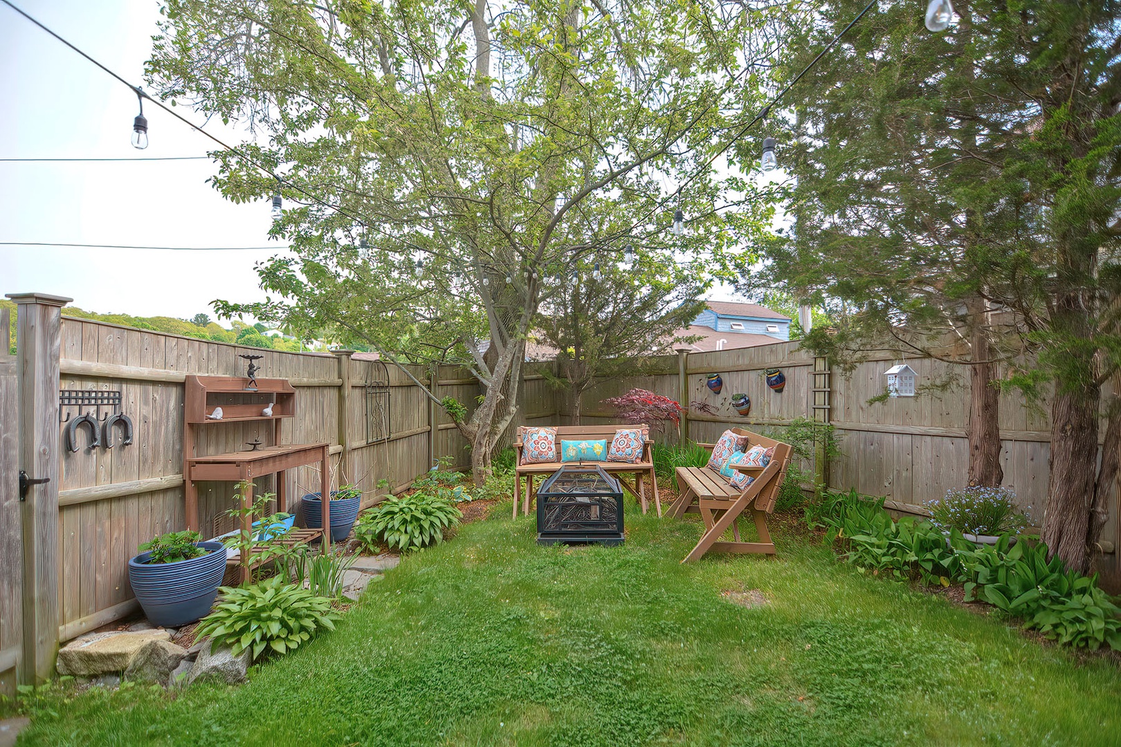 Enjoy sitting outdoors surrounded by shade and gardens.