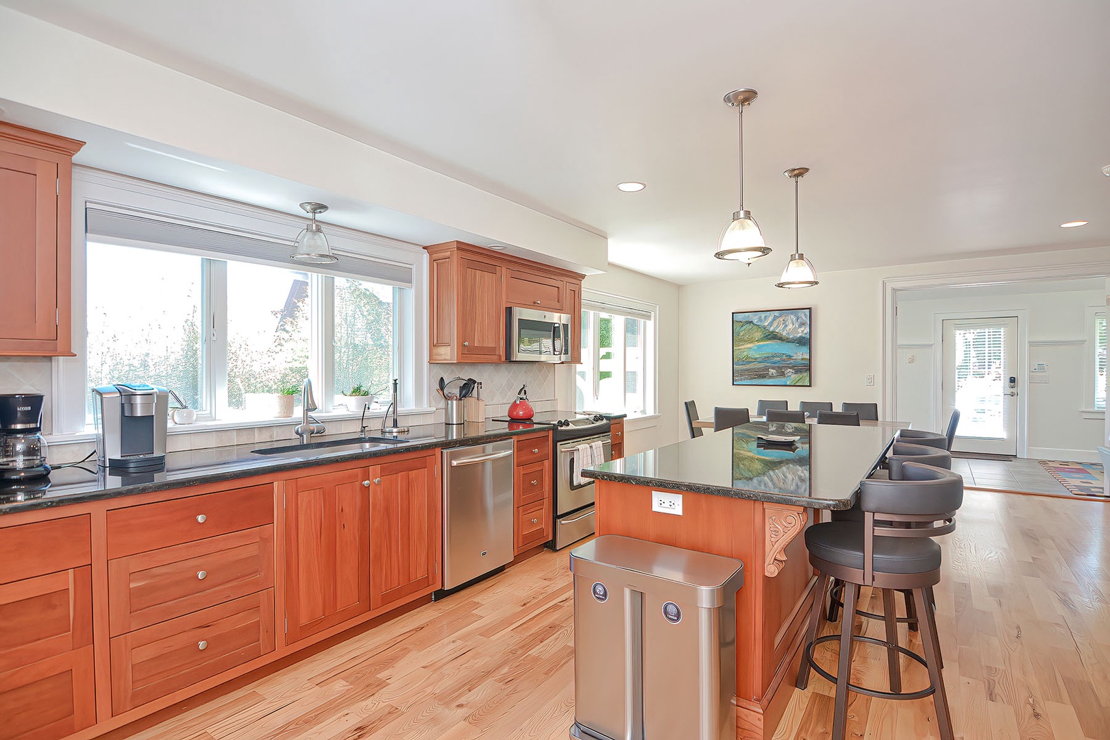 The kitchen is well-equipped with appliances and storage.