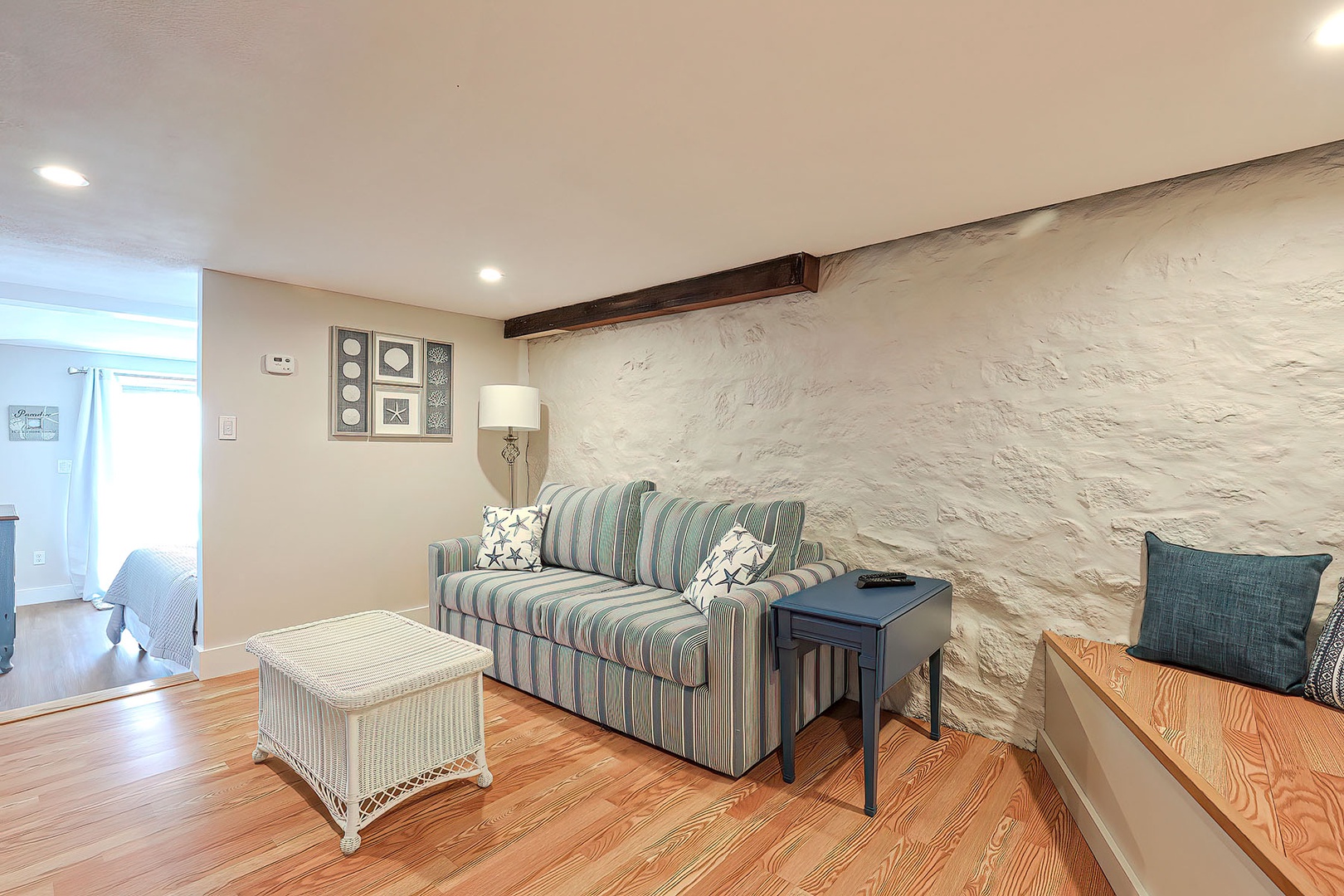 The bedroom is just beyond the sitting area.