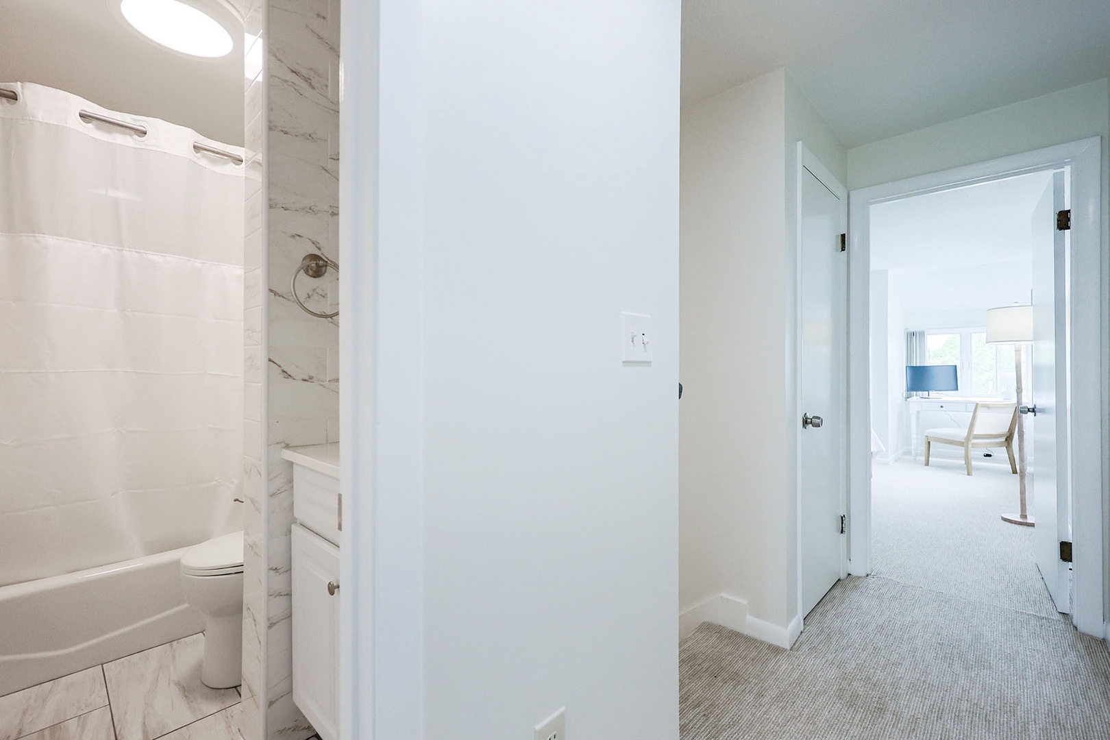 The main bathroom is located in the second floor in the hallway.