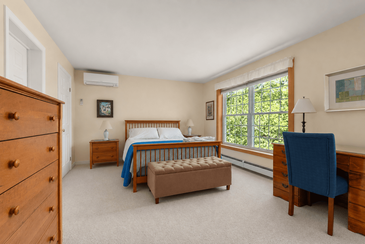 The primary bedroom with a queen bed.