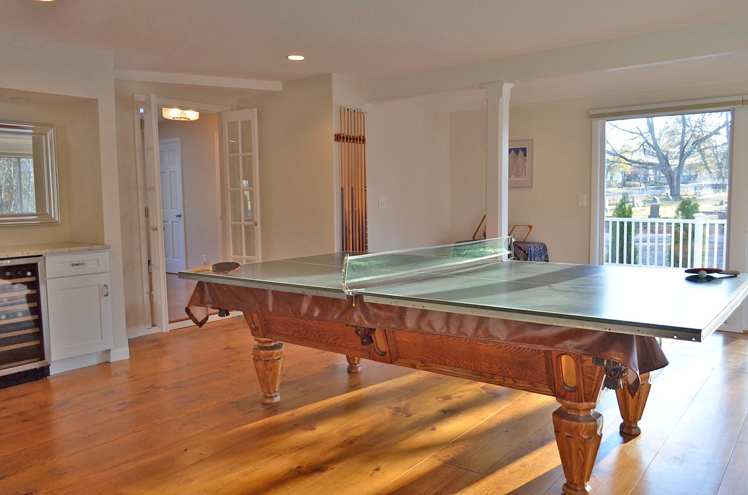 The pool table converts to allow table tennis.