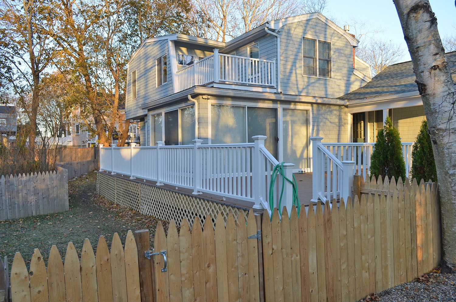 The deck overlooks the fenced back yard.