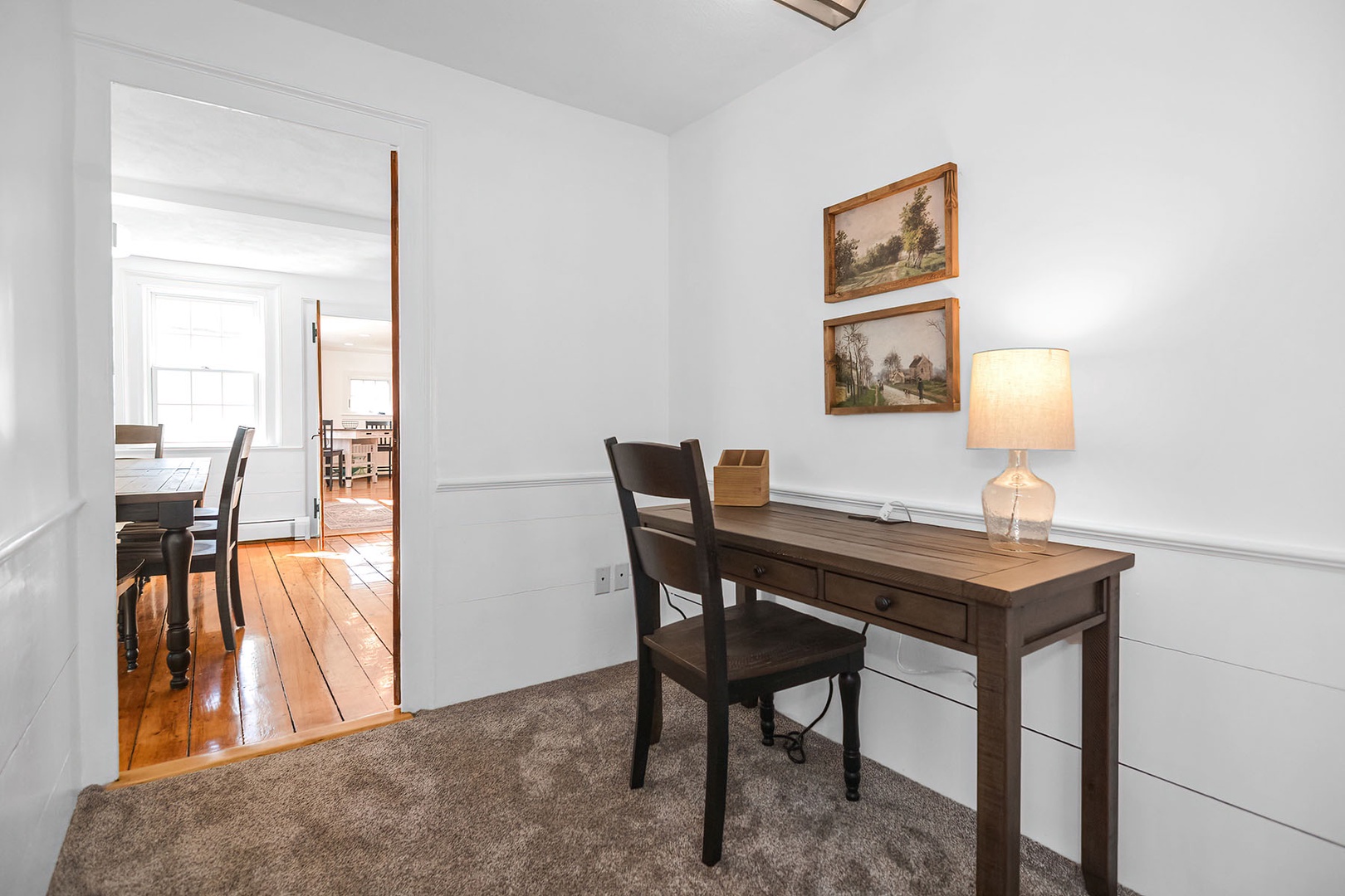 An office nook provides a cozy spot to work.