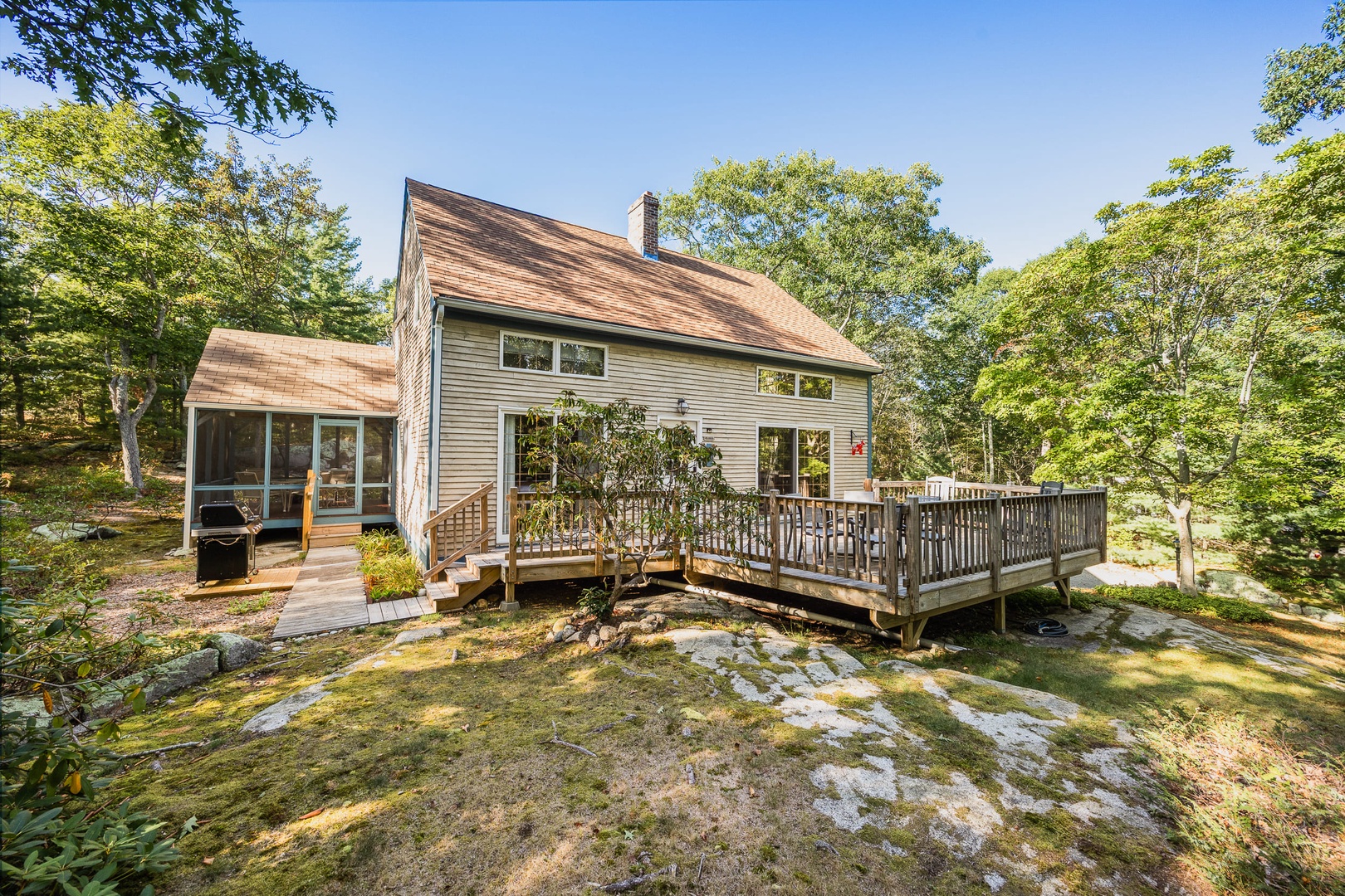 Front of House along with the deck.