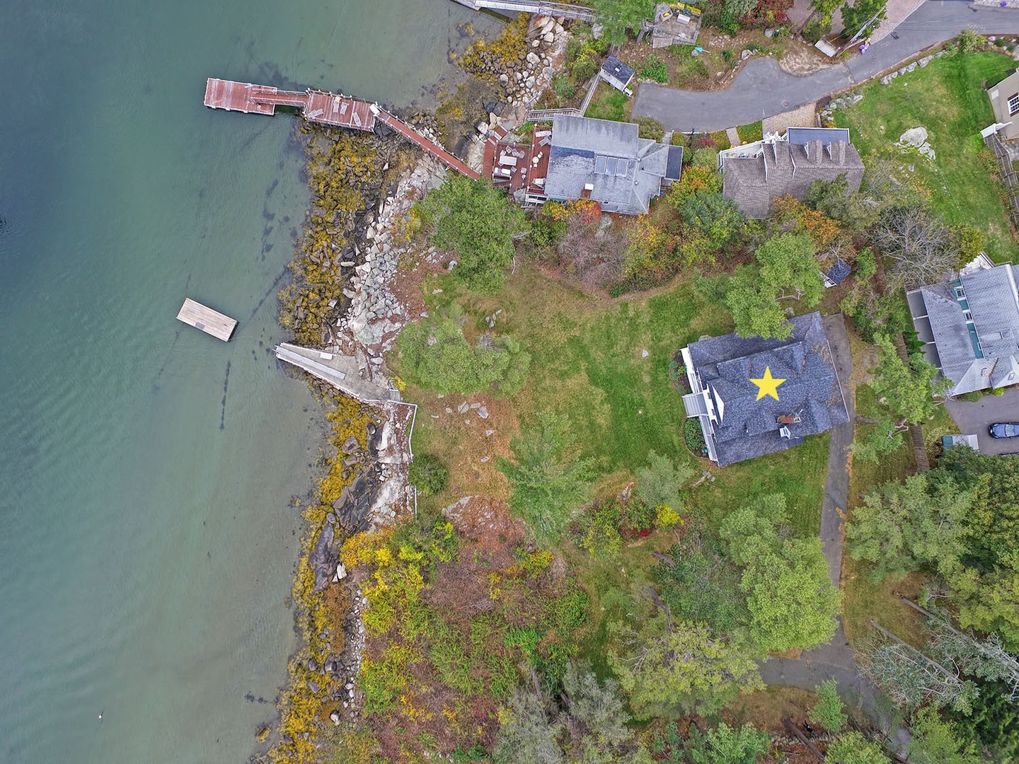 Aerial view of Annisquam Singing Pines (starred) and the river.