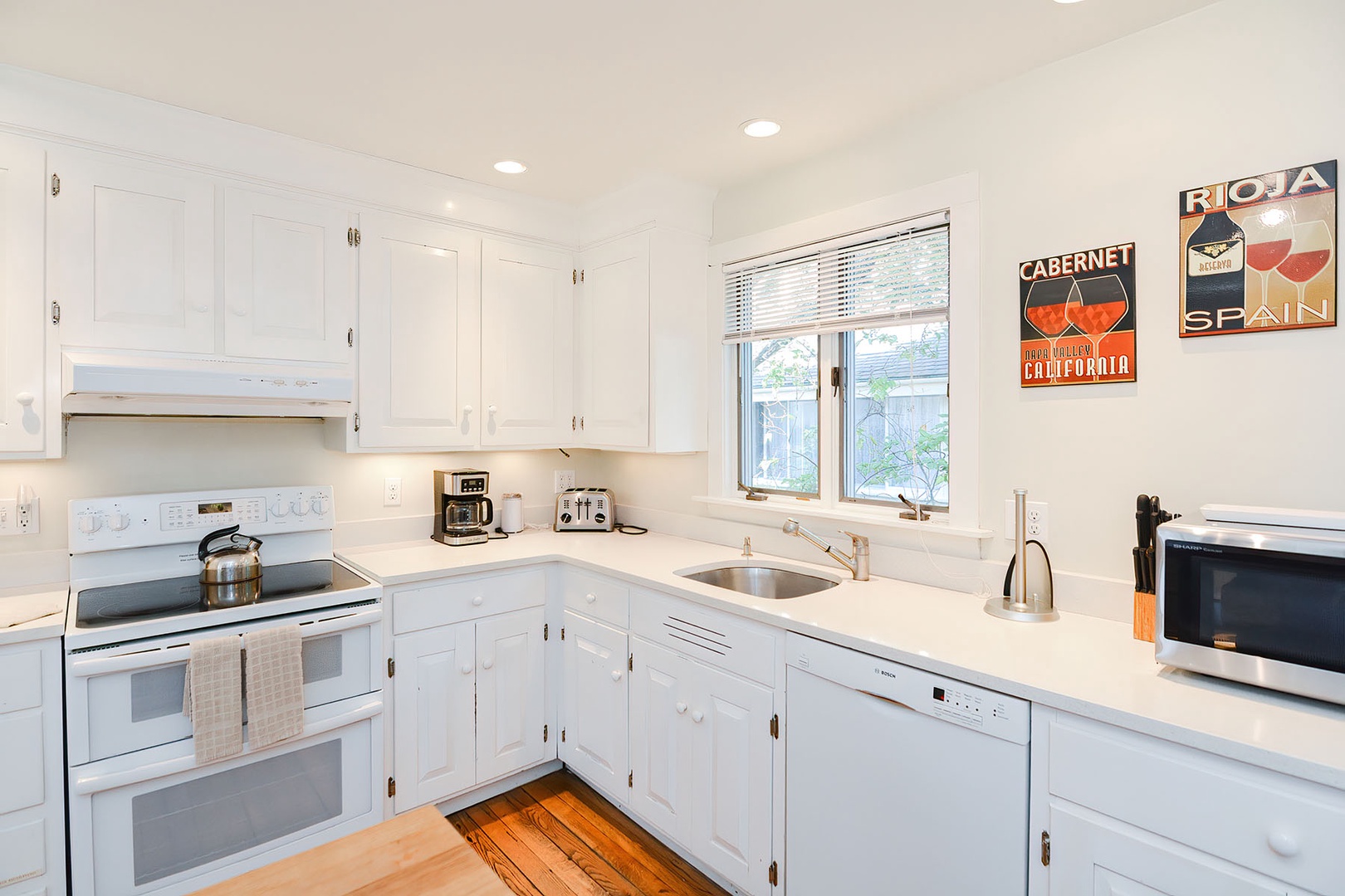 Appliances include an electric range and dishwasher.