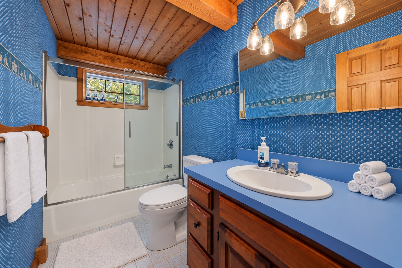 The full-bathroom with a tub.