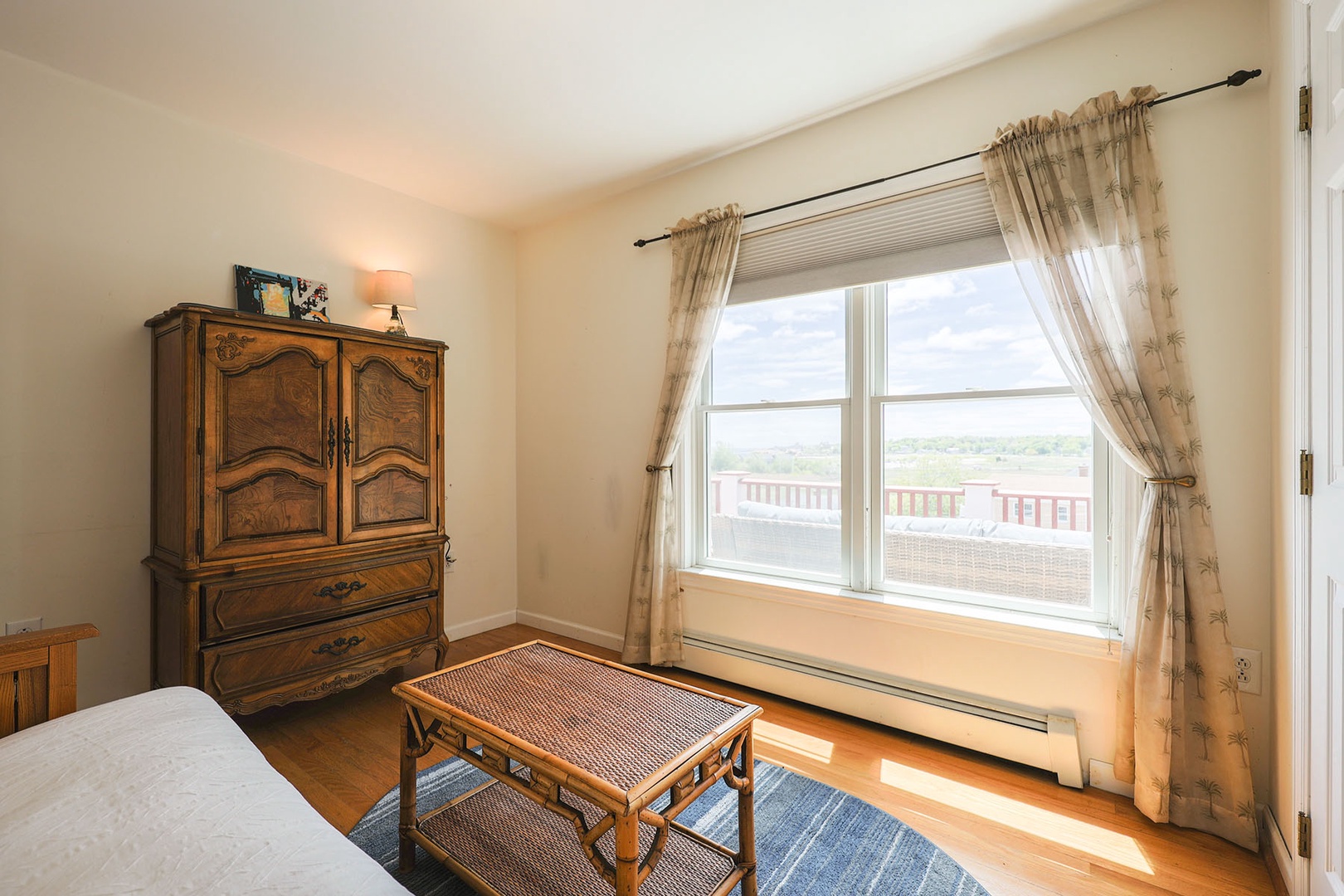 The third bedroom has beautiful views out the window, overlooking the upper deck