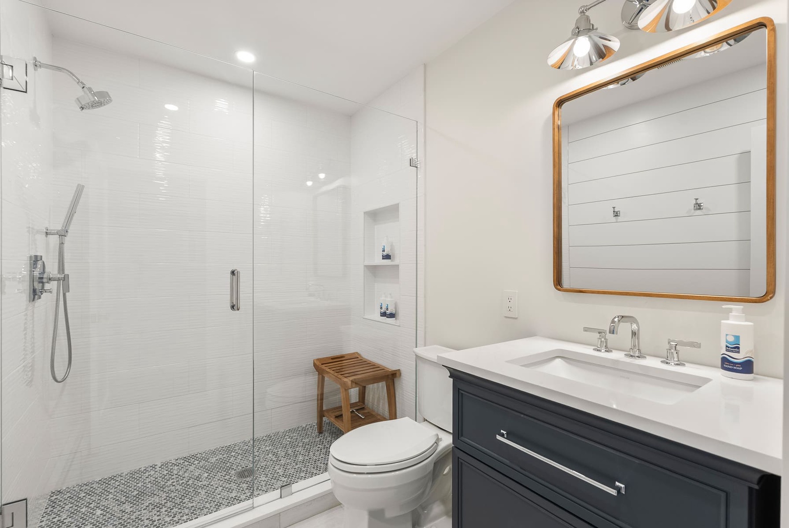 Full hall bathroom with a walk-in shower