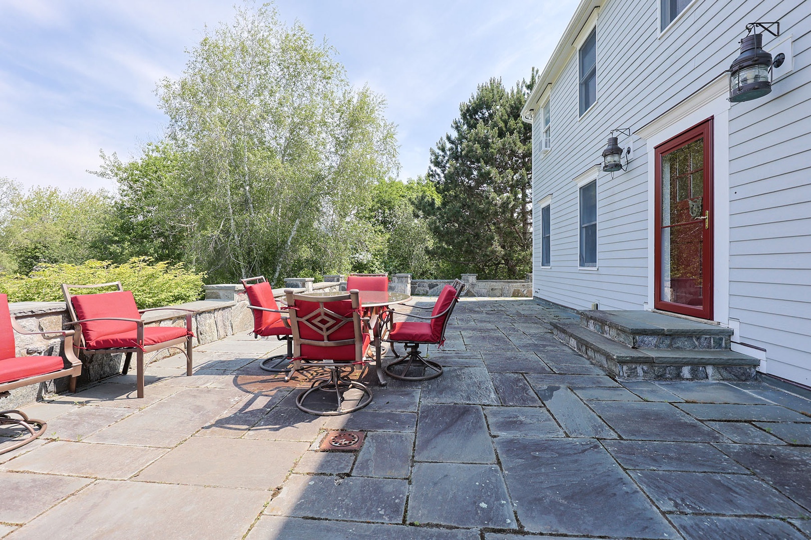 Large slate patio at the front of the home.