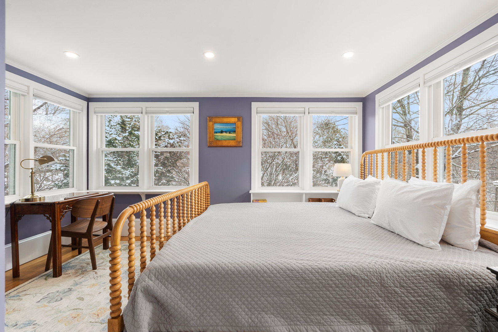 The primary bedroom is surrounded by views outside.