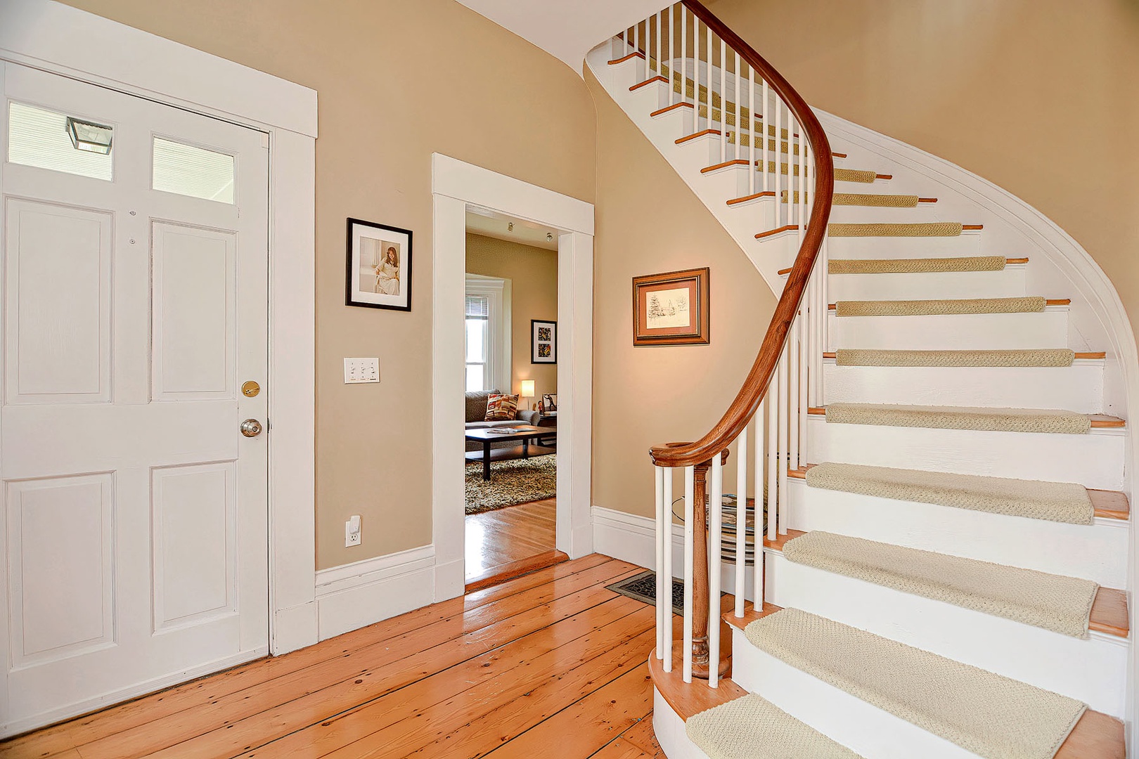 Main staircase to the second floor, looking toward the living room.
