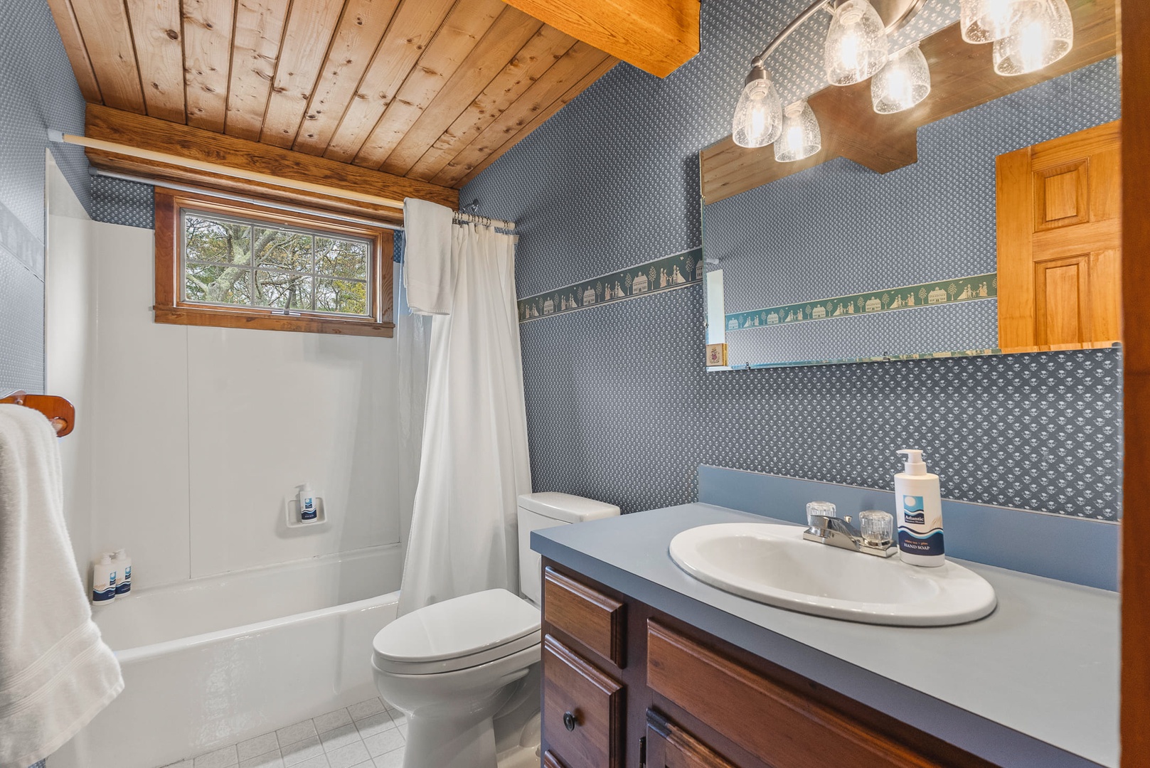 The full-bathroom with a tub.
