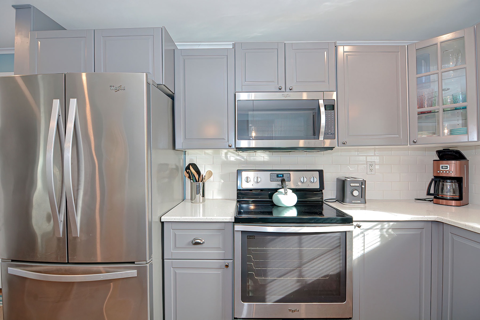 The renovated kitchen is well-equipped with appliances.