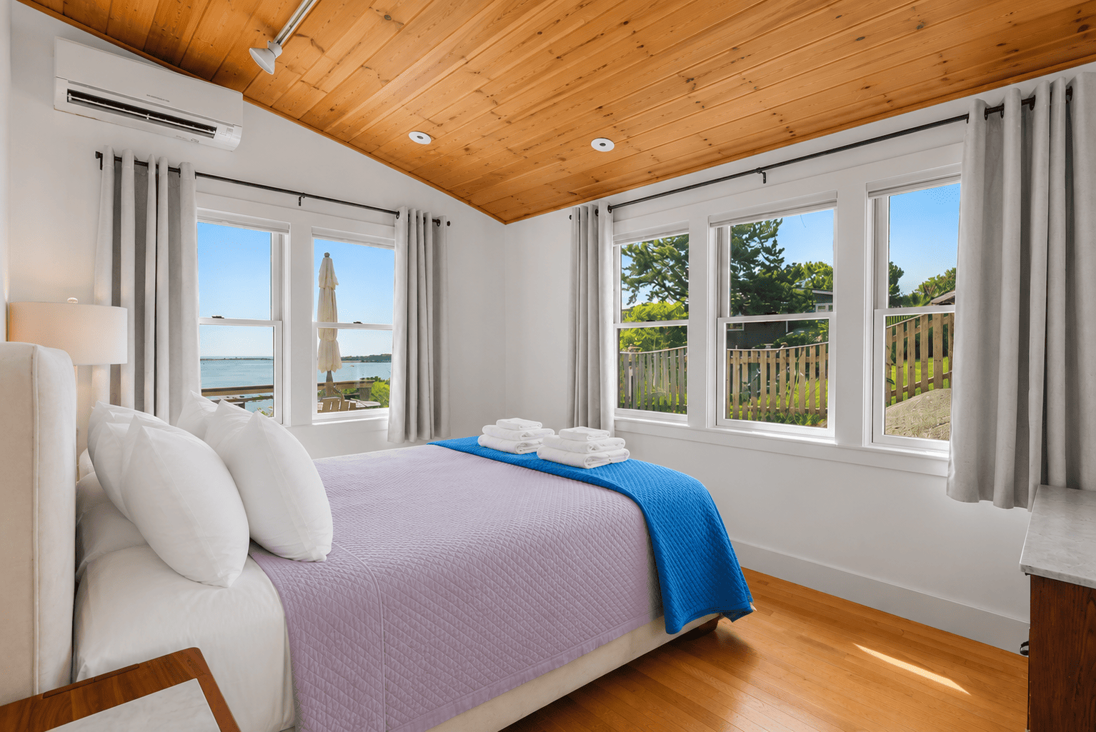 Ground floor second bedroom with a queen bed and amazing ocean views.