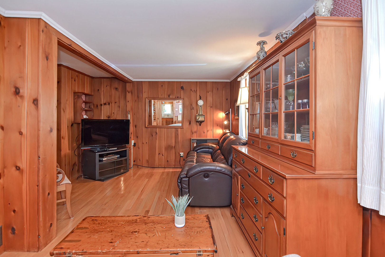 Watch tv or a movie in the cozy pine-paneled den.