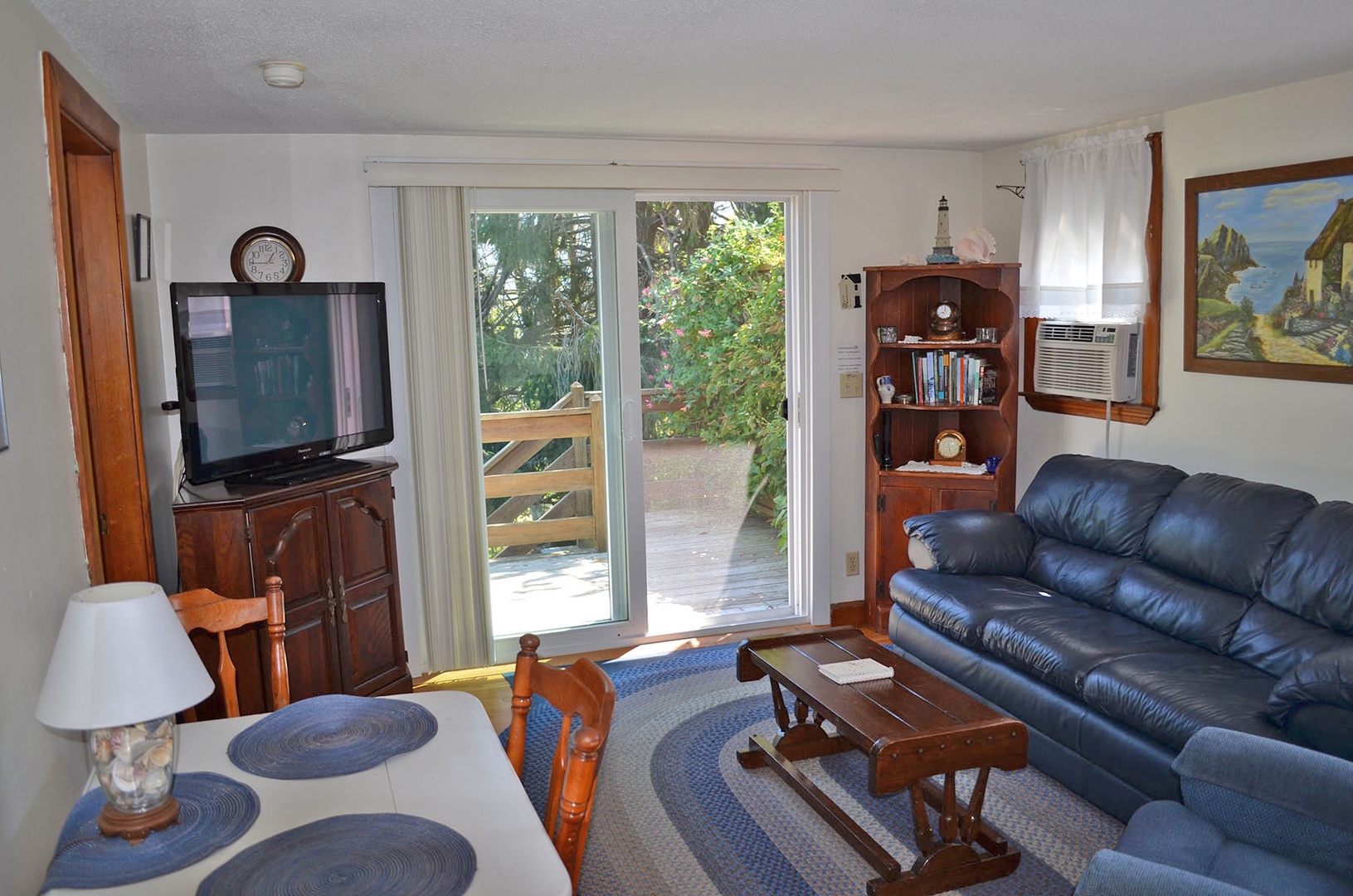 Living room with tv and comfortable seating.