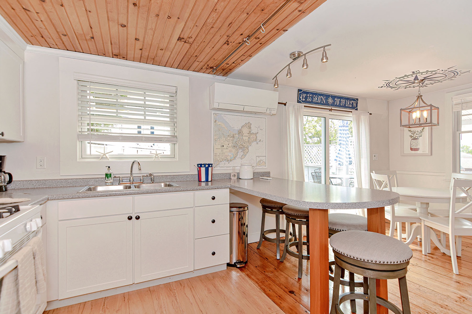 The Kitchen is well-applianced and has a breakfast bar.