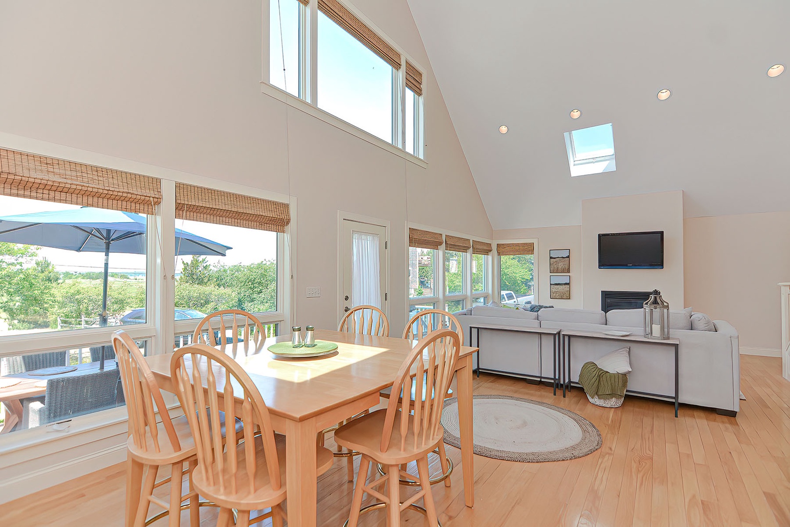 The many large windows and skylights fill the room with natural light.