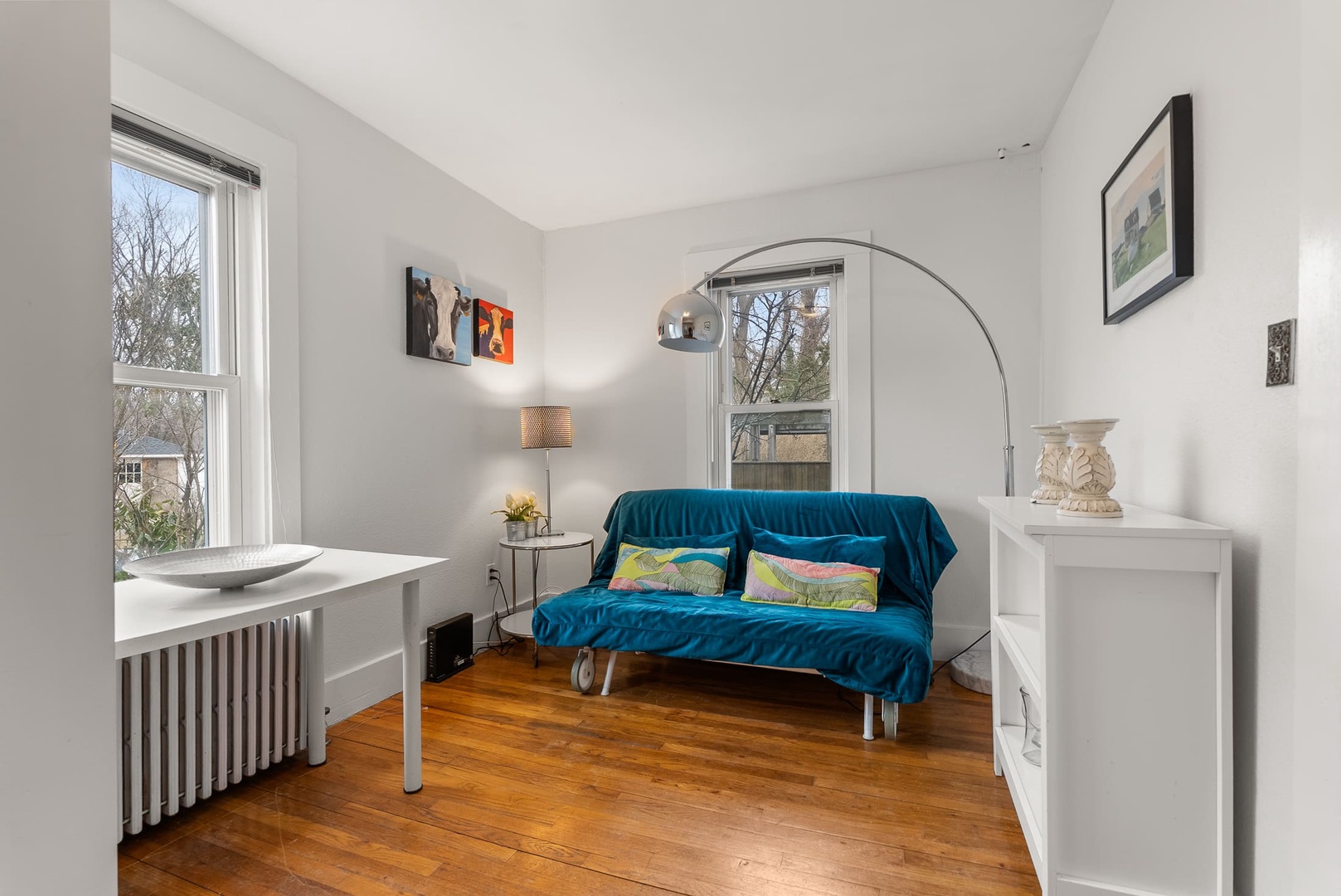 A cozy den with futon provides extra space to sleep or relax.