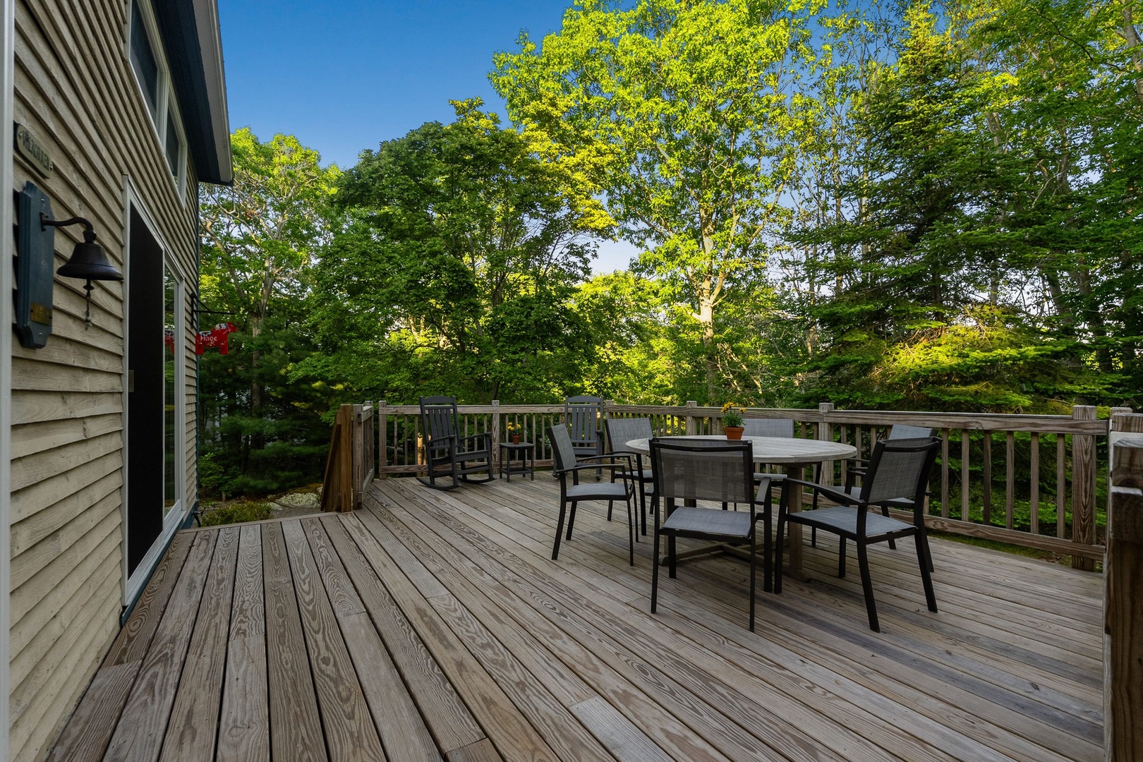 The beautiful deck, surrounded by trees, fresh air, and the peaceful sounds of nature.