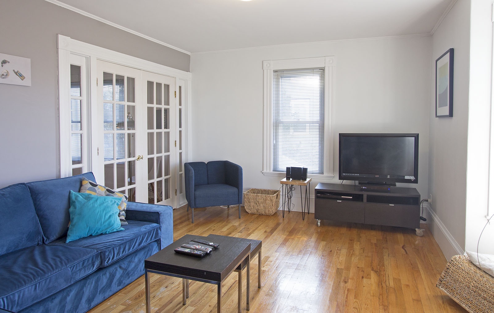 The living room includes a flat-screen tv and sectional sofa.