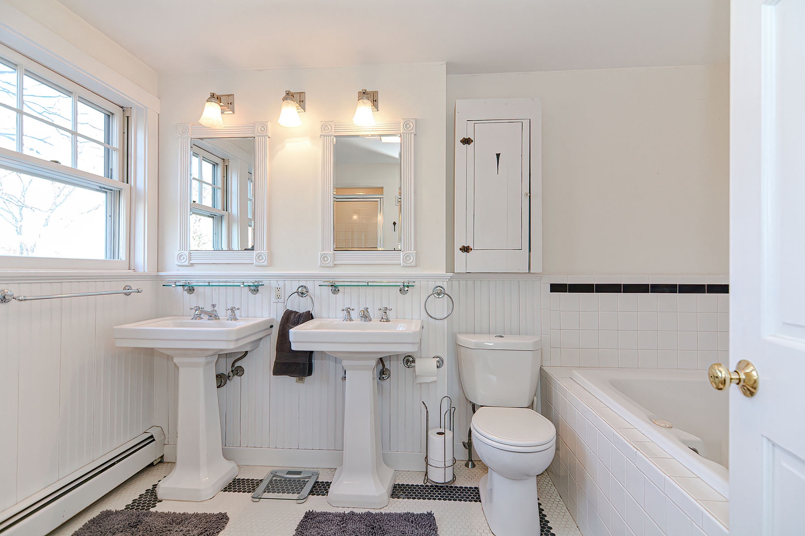 Full bath with double sink.