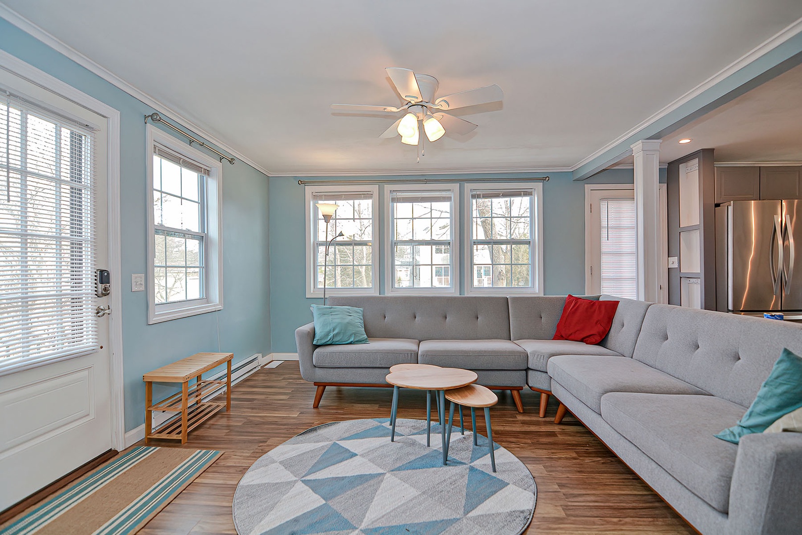 The open plan living room is filled with beautiful natural light