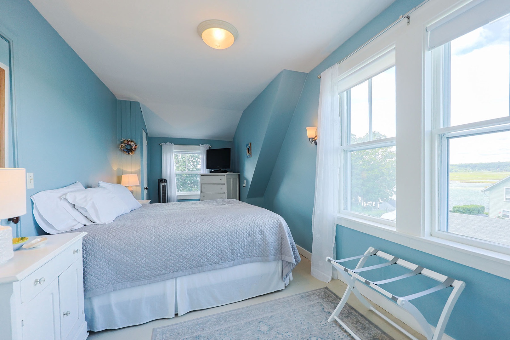 Primary Bedroom: includes a King bed and has river views.