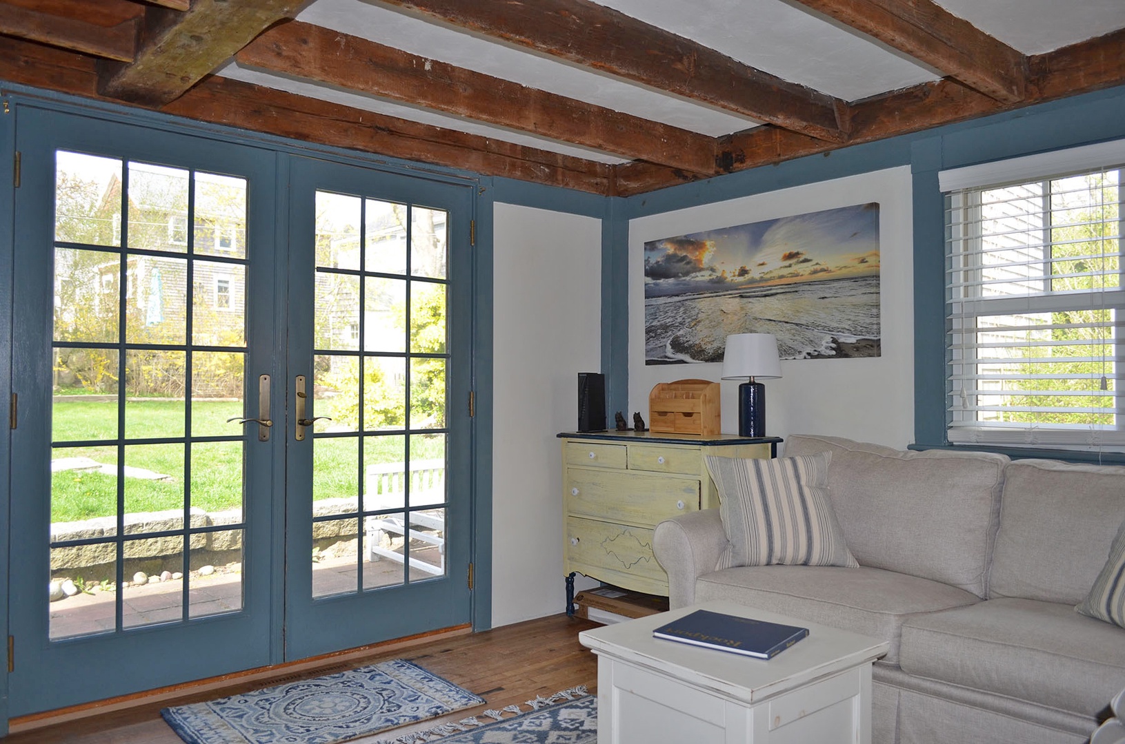The den with French doors opens up to the back patio and yard.
