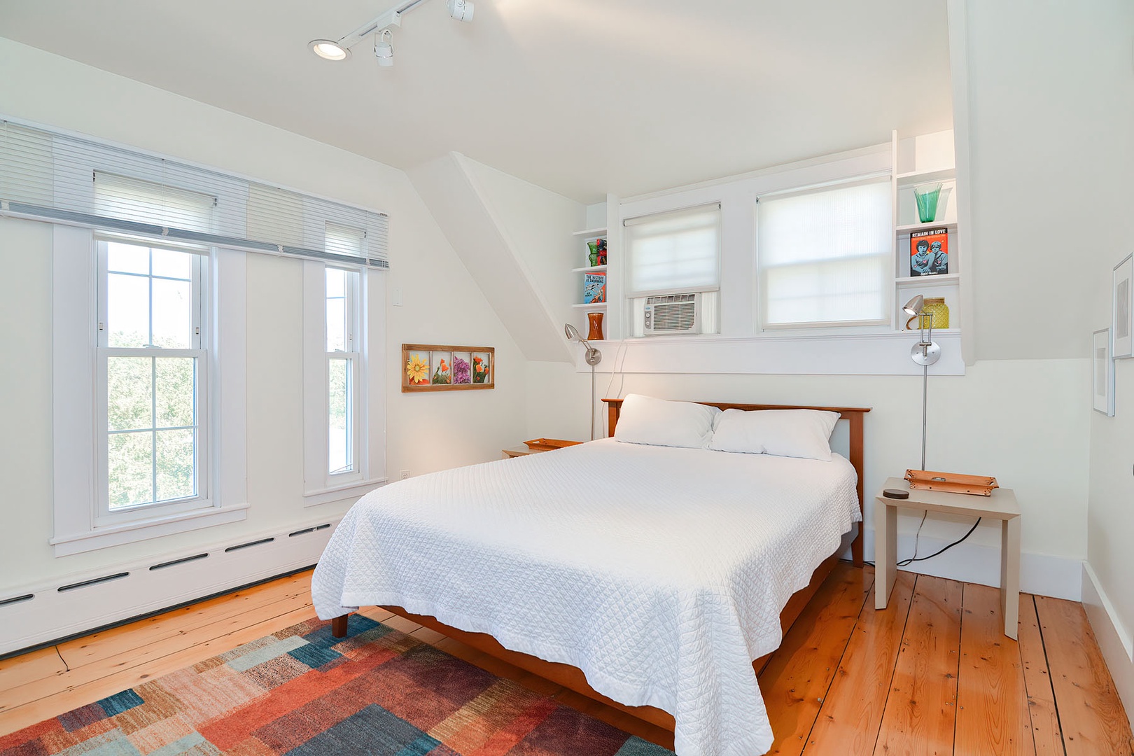 BR 2: Queen Bedroom with window A/C unit.