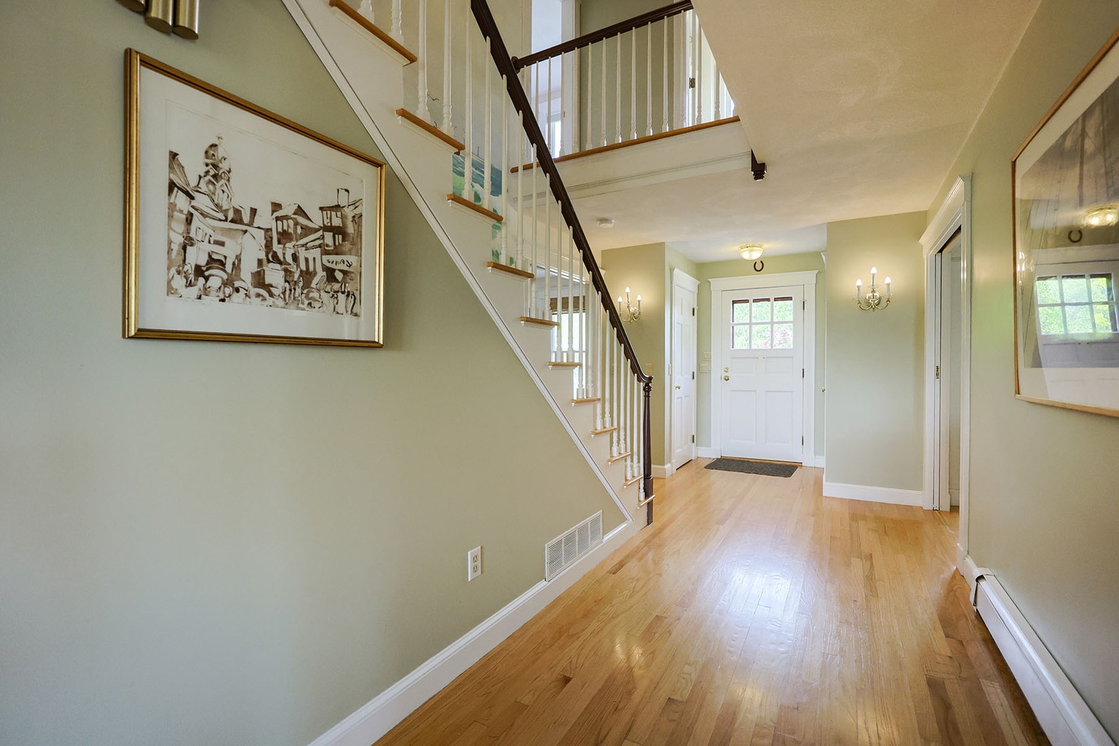 The main hall connects the living rooms, kitchen, dining room & sun porch.