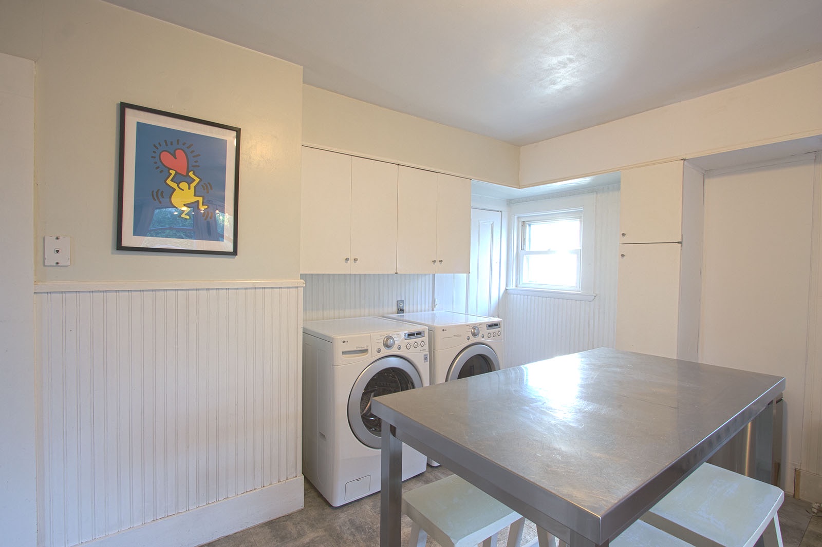 The washer and dryer are conveniently located in the kitchen.