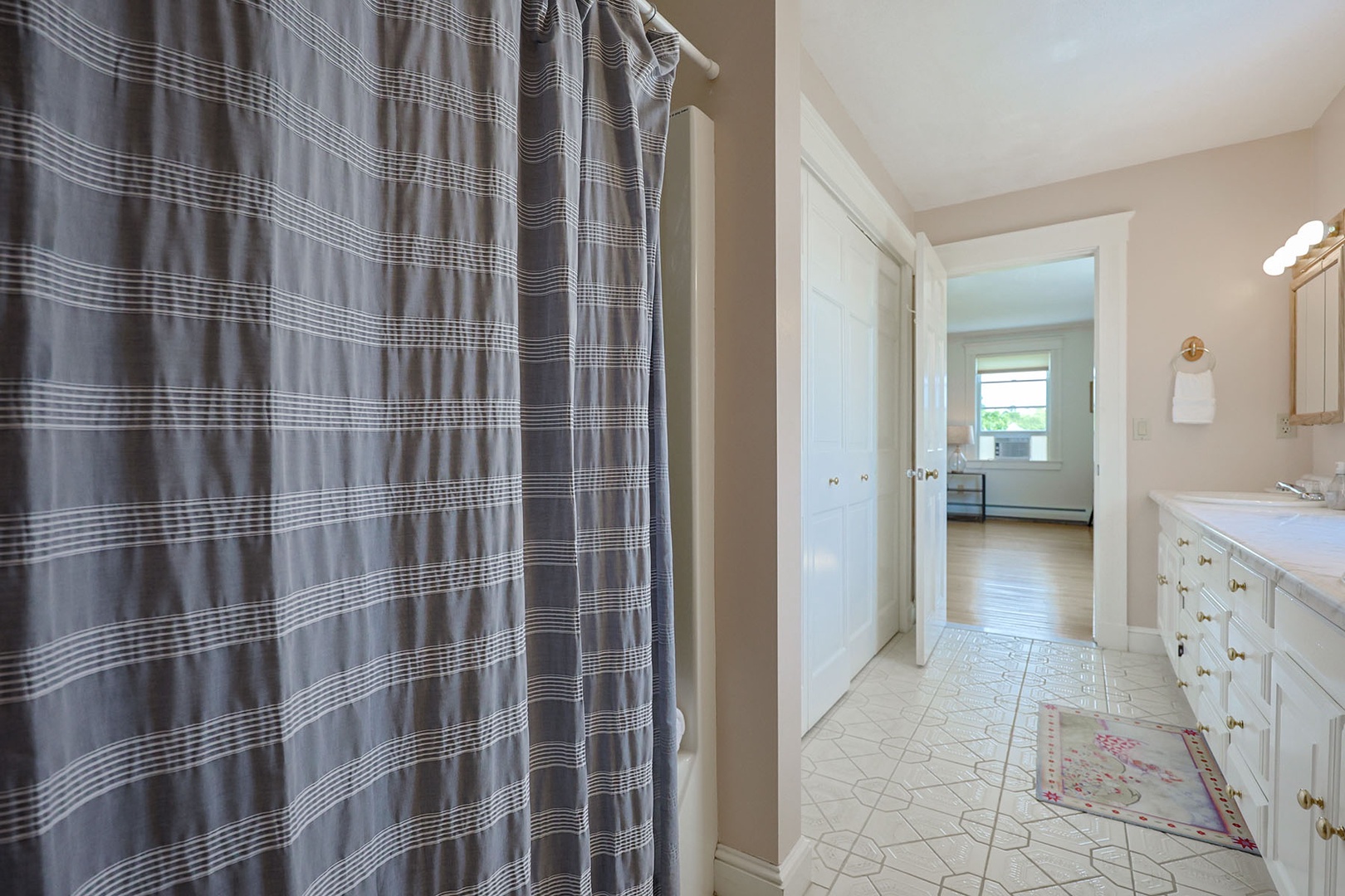 Second primary bedroom ensuite bath has a tub/shower combo.