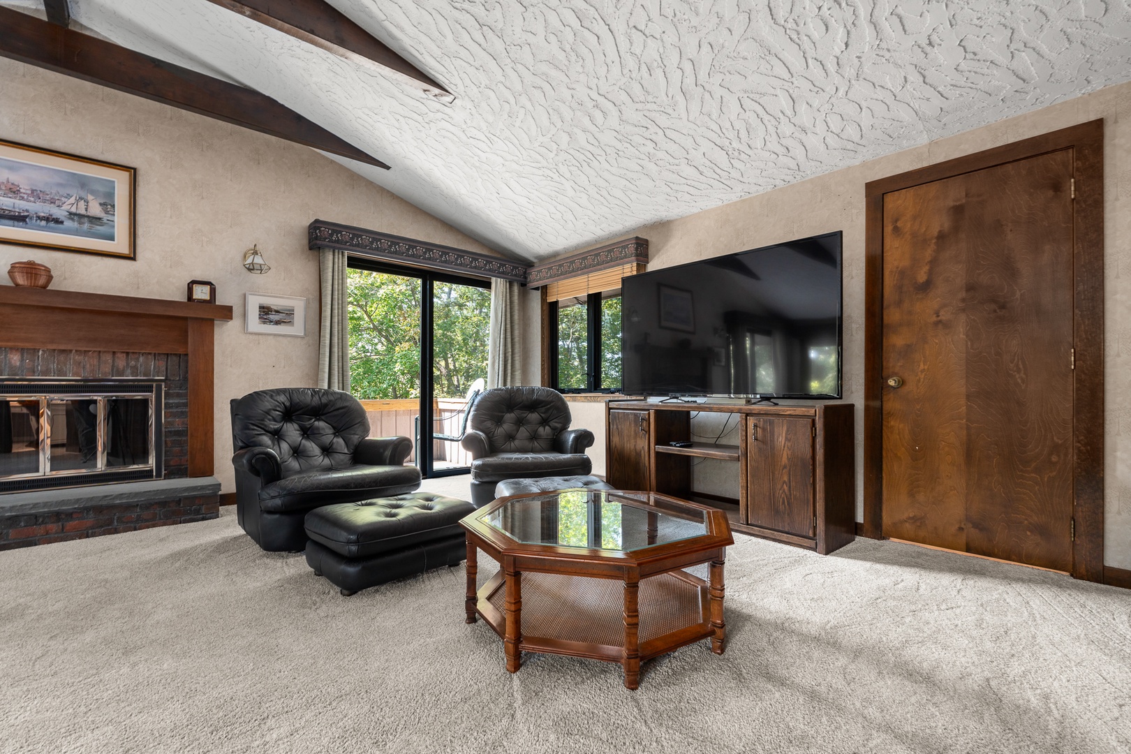 The TV lounge in the primary bedroom includes a widescreen smart TV.