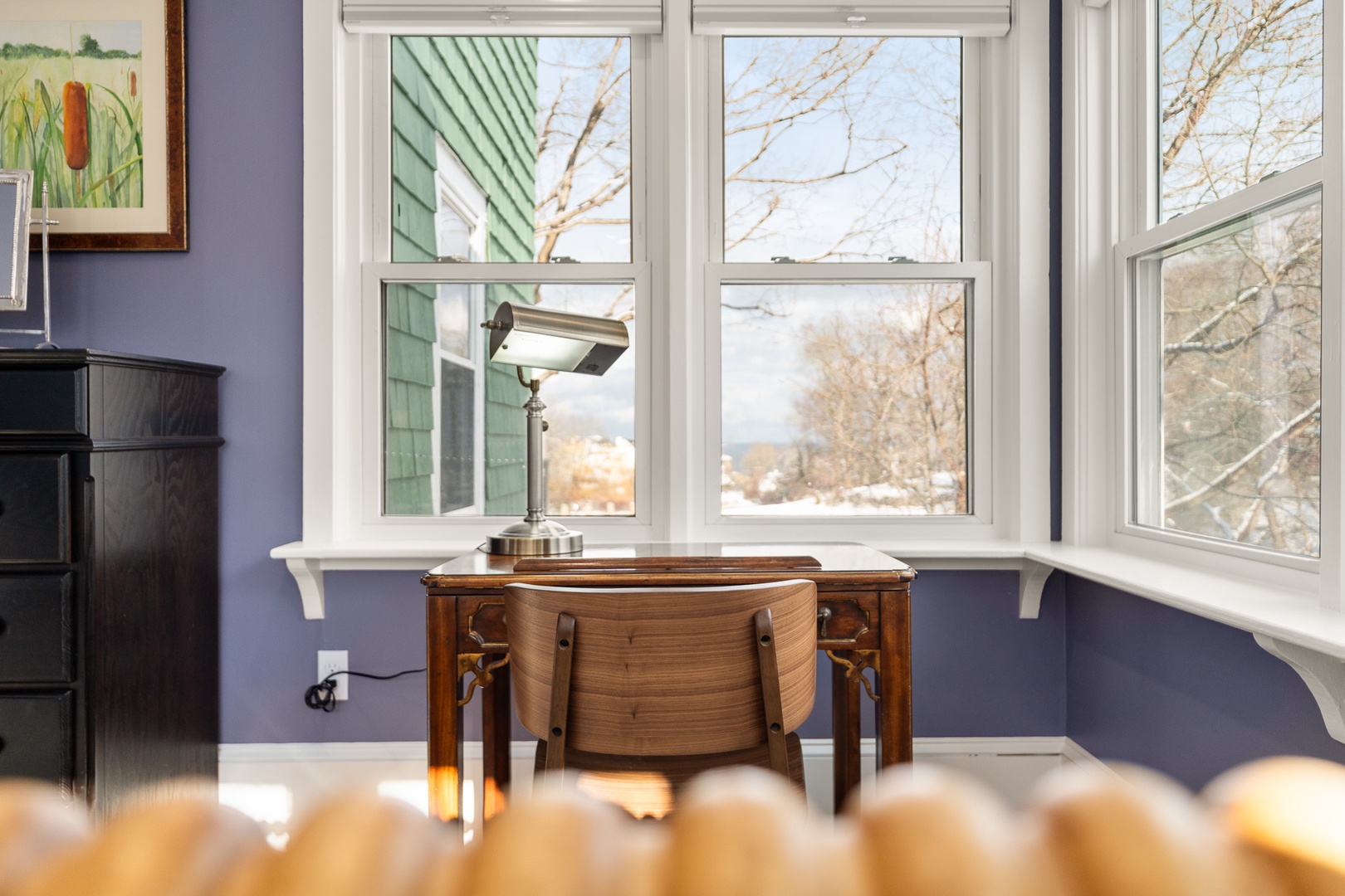 The primary bedroom includes a workspace with a view.