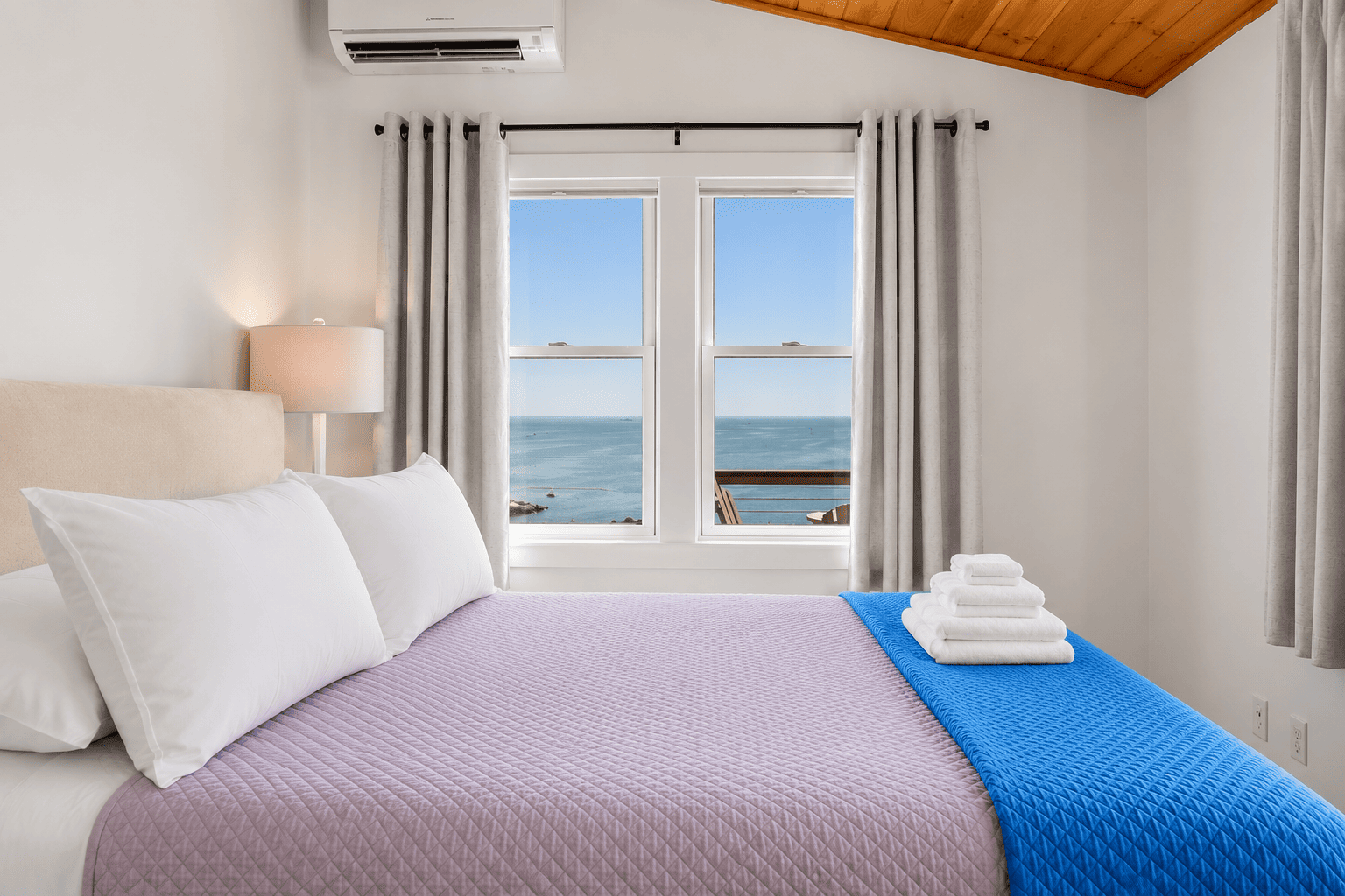 Second bedroom with a queen bedroom and amazing ocean views.