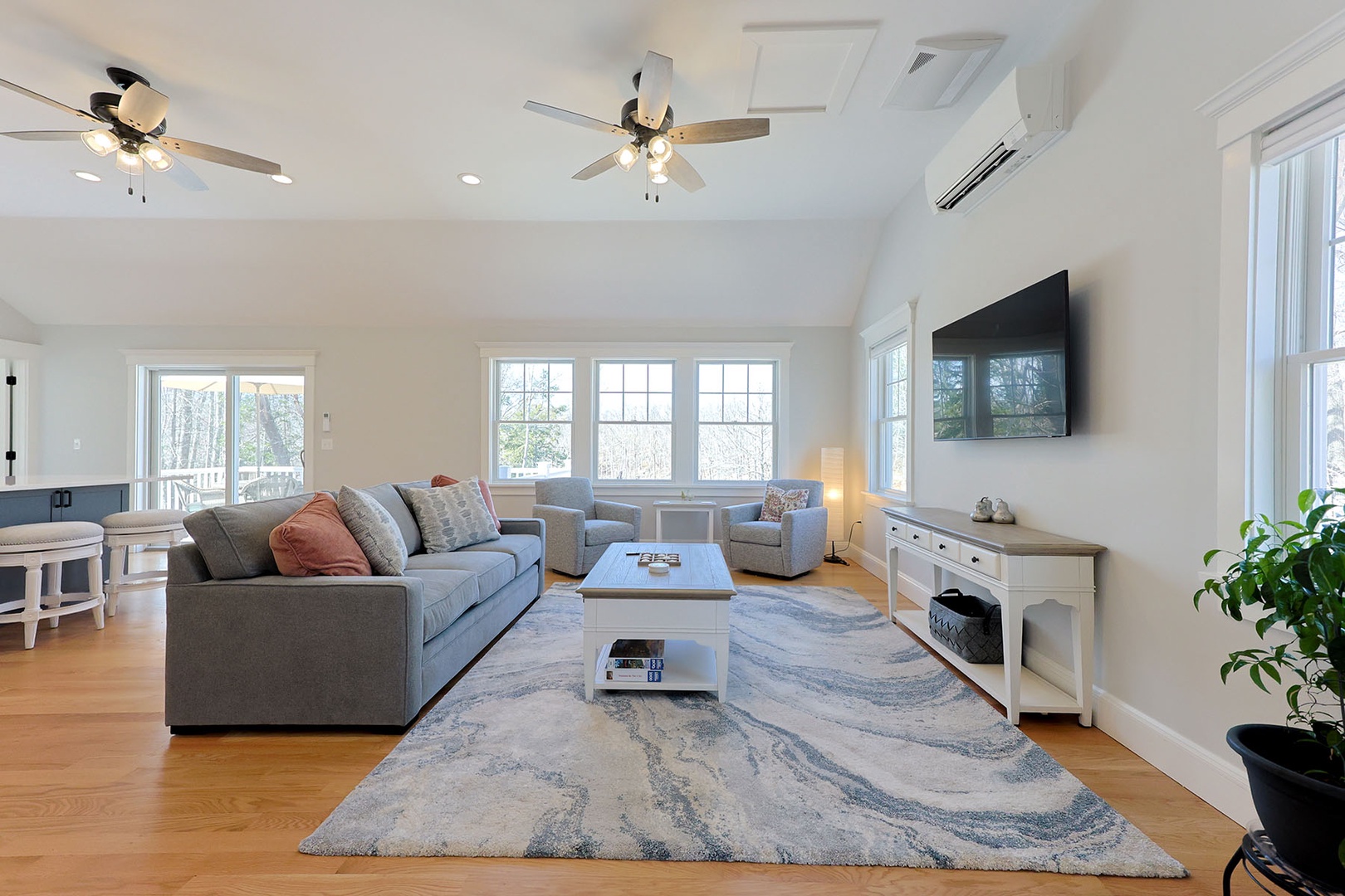 Living room with wall-mounted TV.