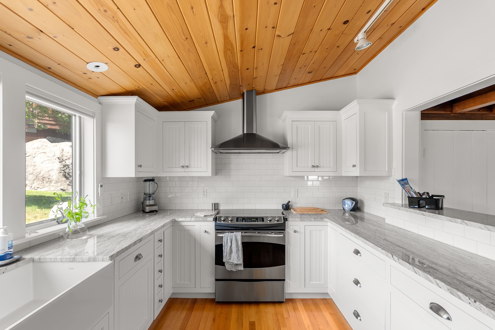 The kitchen has ample counter space and storage for meal prep.