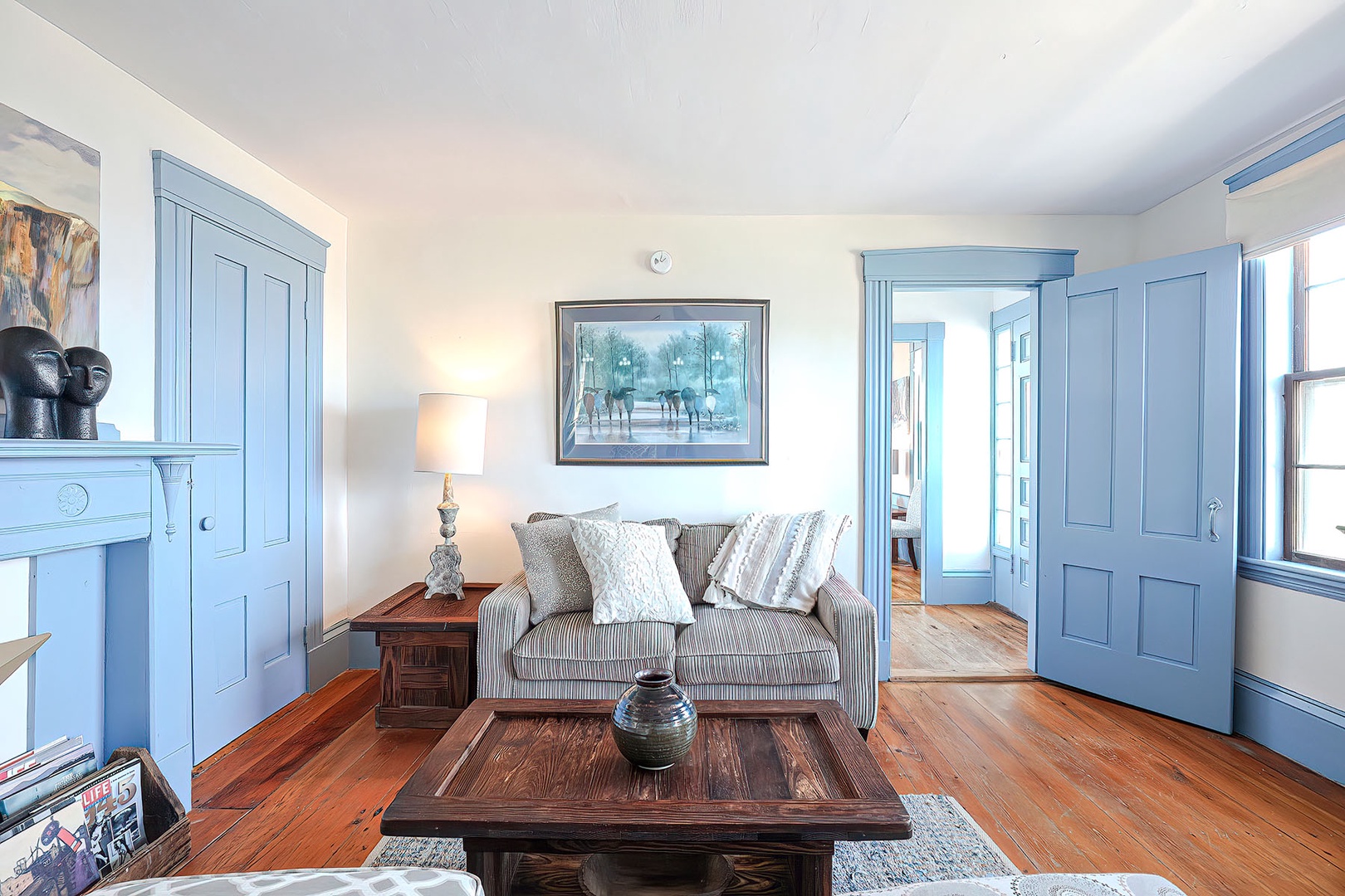 Living room, looking toward the dining room and stairs to the 2nd level.