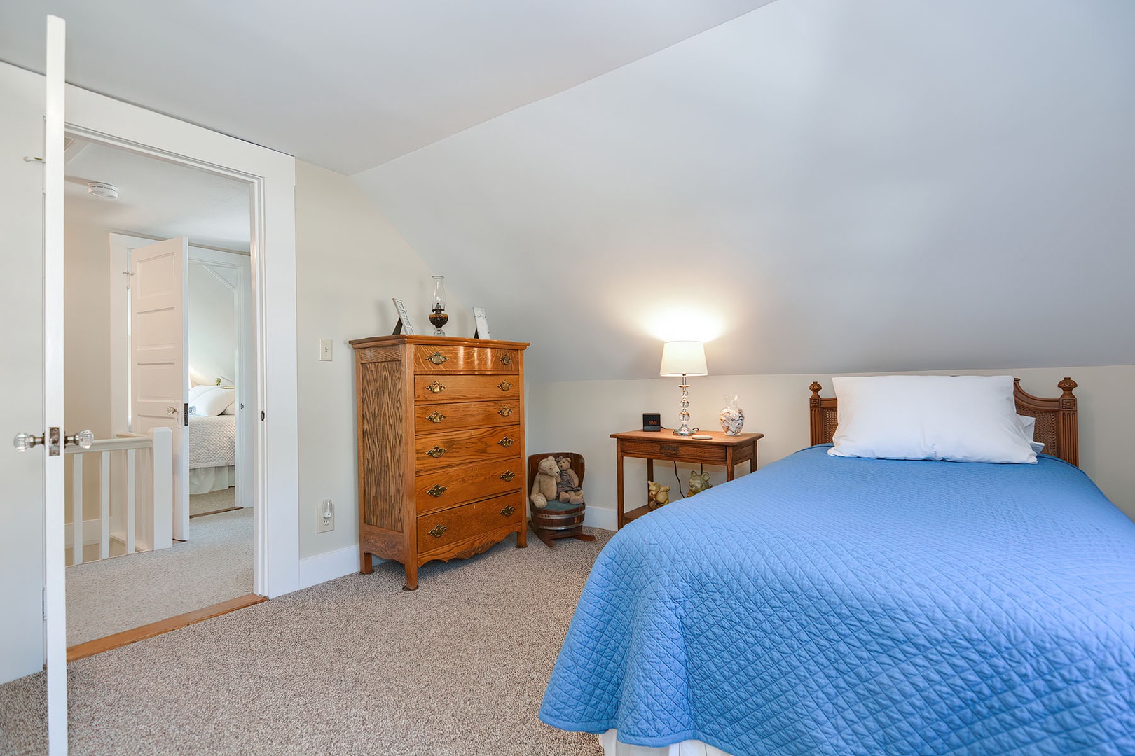 This bedroom includes a spacious drawer closet for convenient storage.