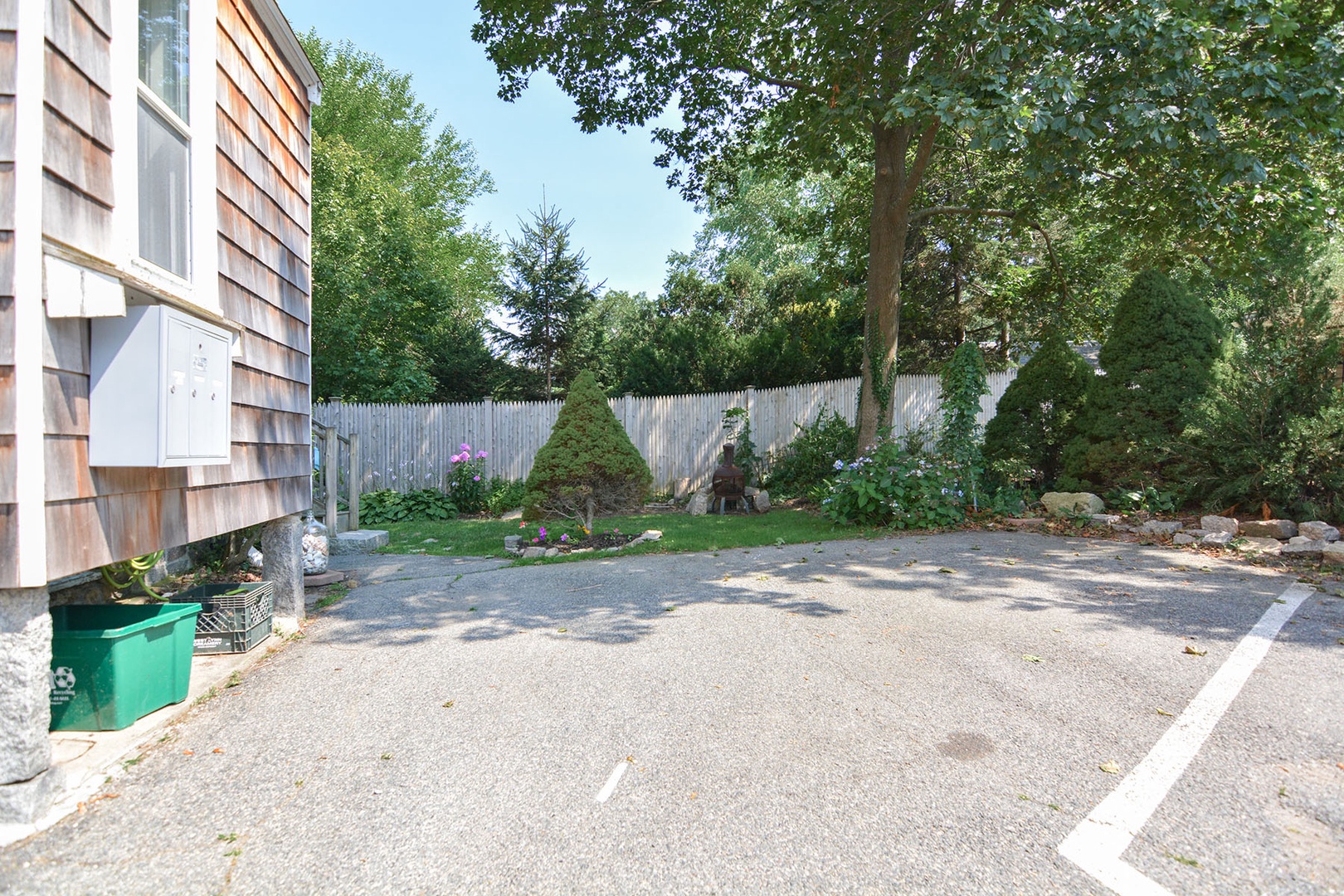 Driveway with one dedicated parking space.
