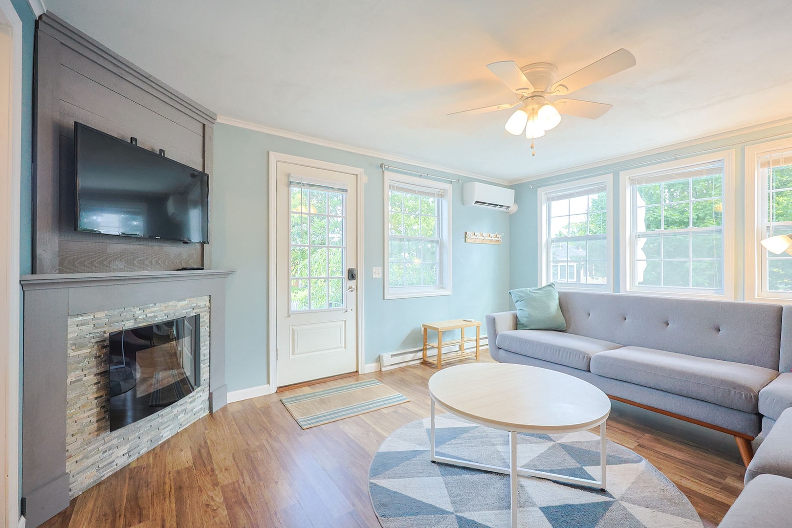 The open plan living room is filled with beautiful natural light